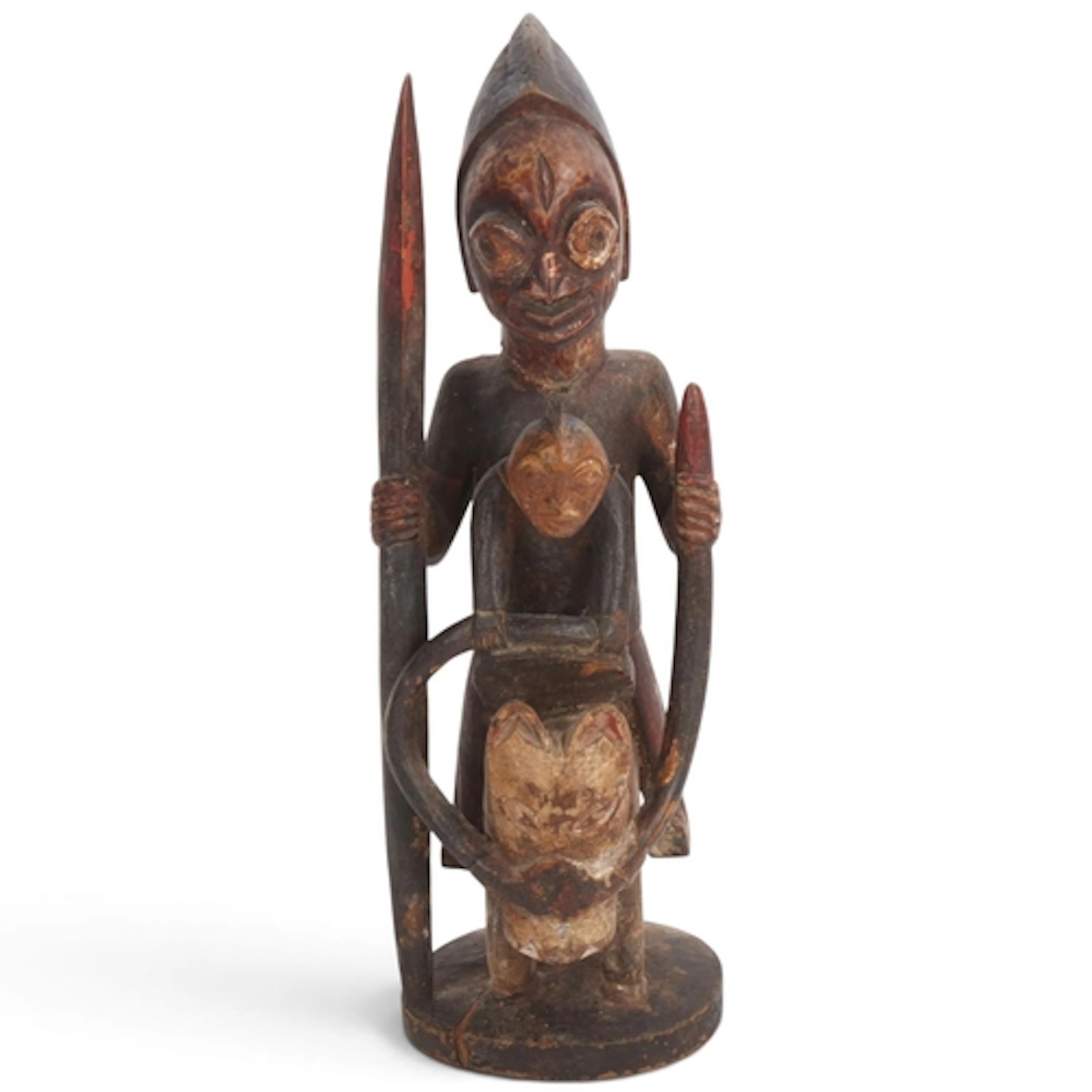 A Yoruba horse and rider sculpture, carved and painted wood,...