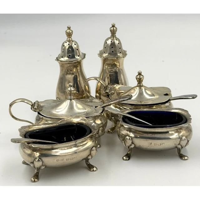 A silver cruet set by E S Barnsley & Co, hallmarked for ...