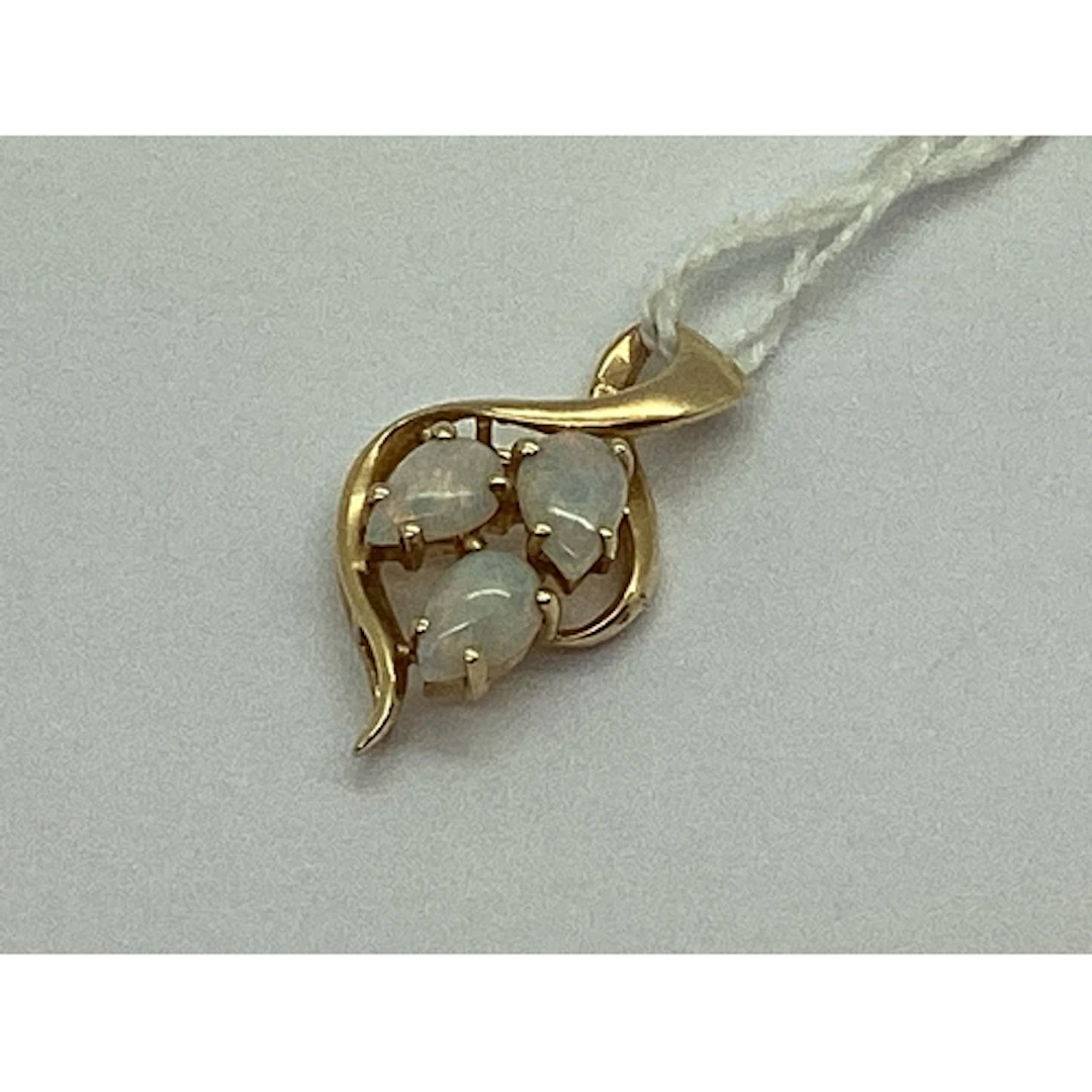 A Three Stone Opal Pendant, of abstract design, teardrop cab...