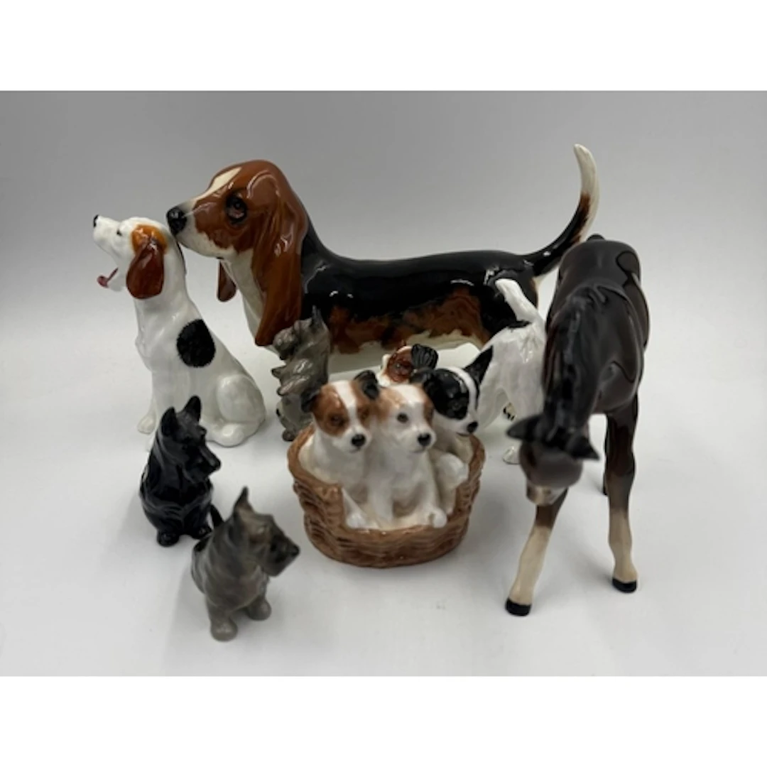 A selection of ceramic animals to include Royal Doulton pupp...