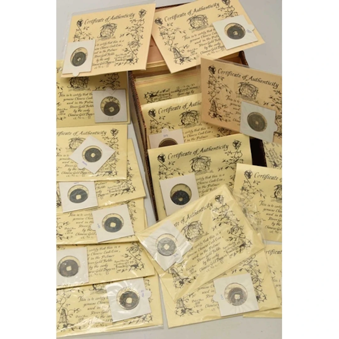 A small box containing 23 carded Chinese Cash Coins used in ...