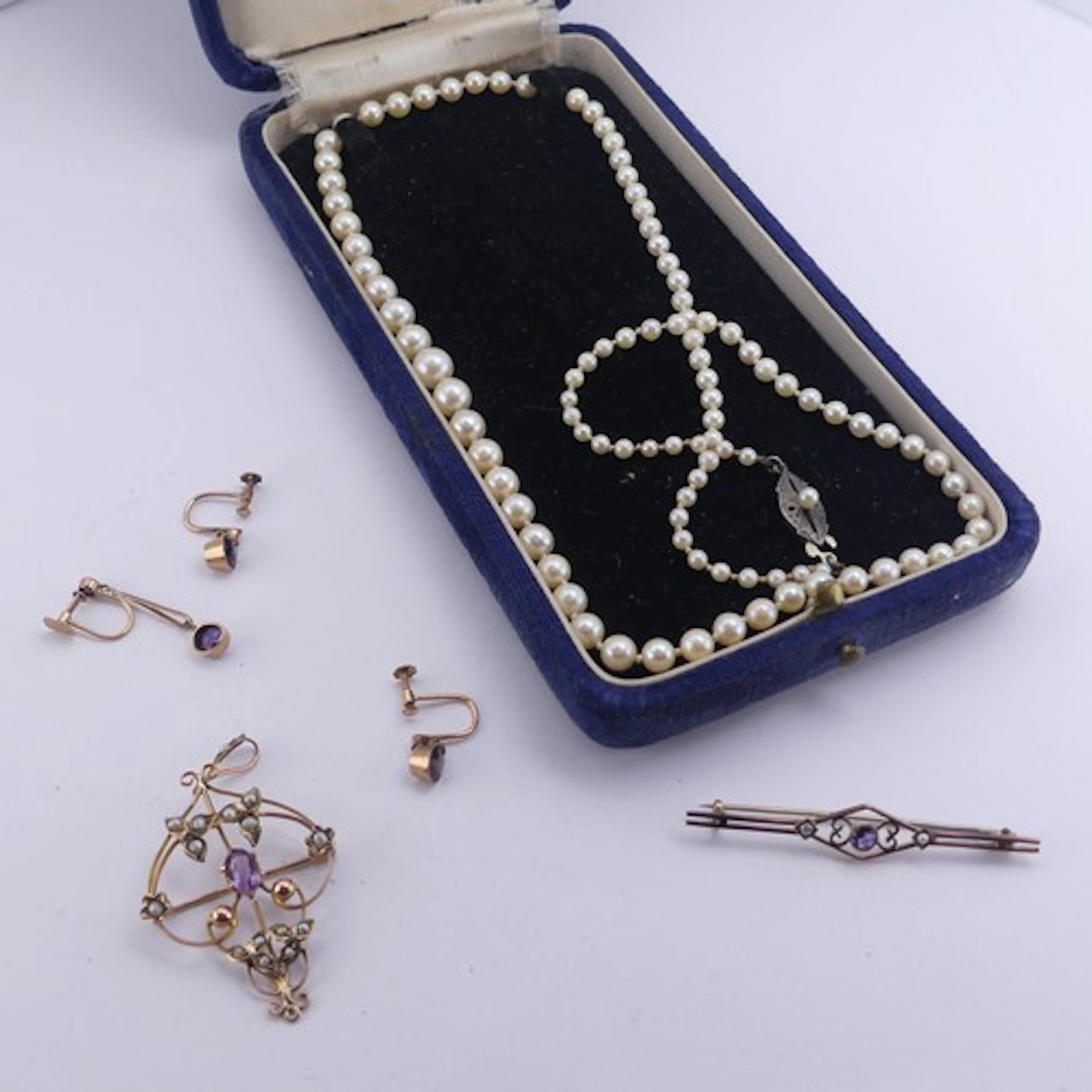 A 9ct gold, amethyst and seed pearl Pendant, in the Art Nouv...
