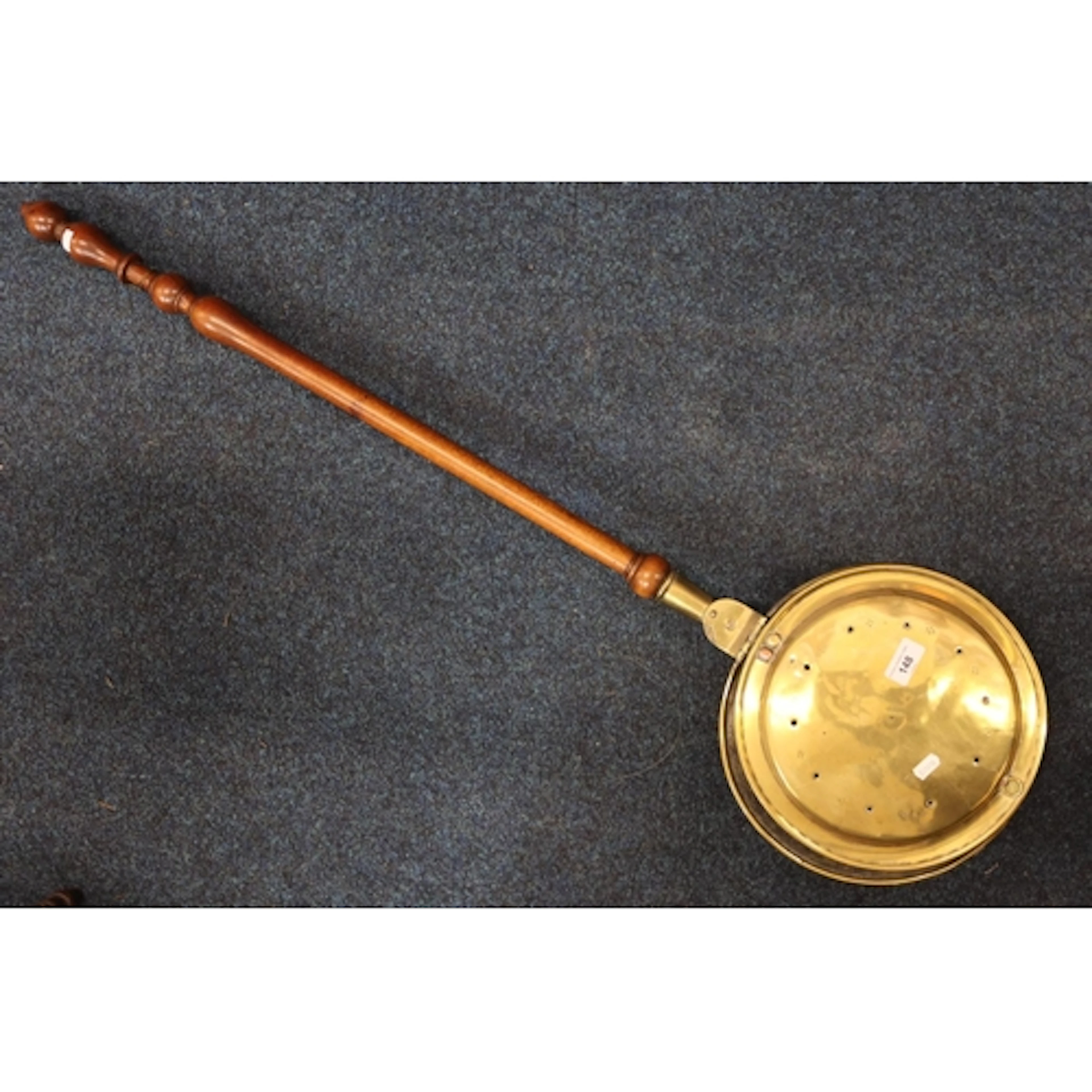 Brass bed warming pan of typical form.