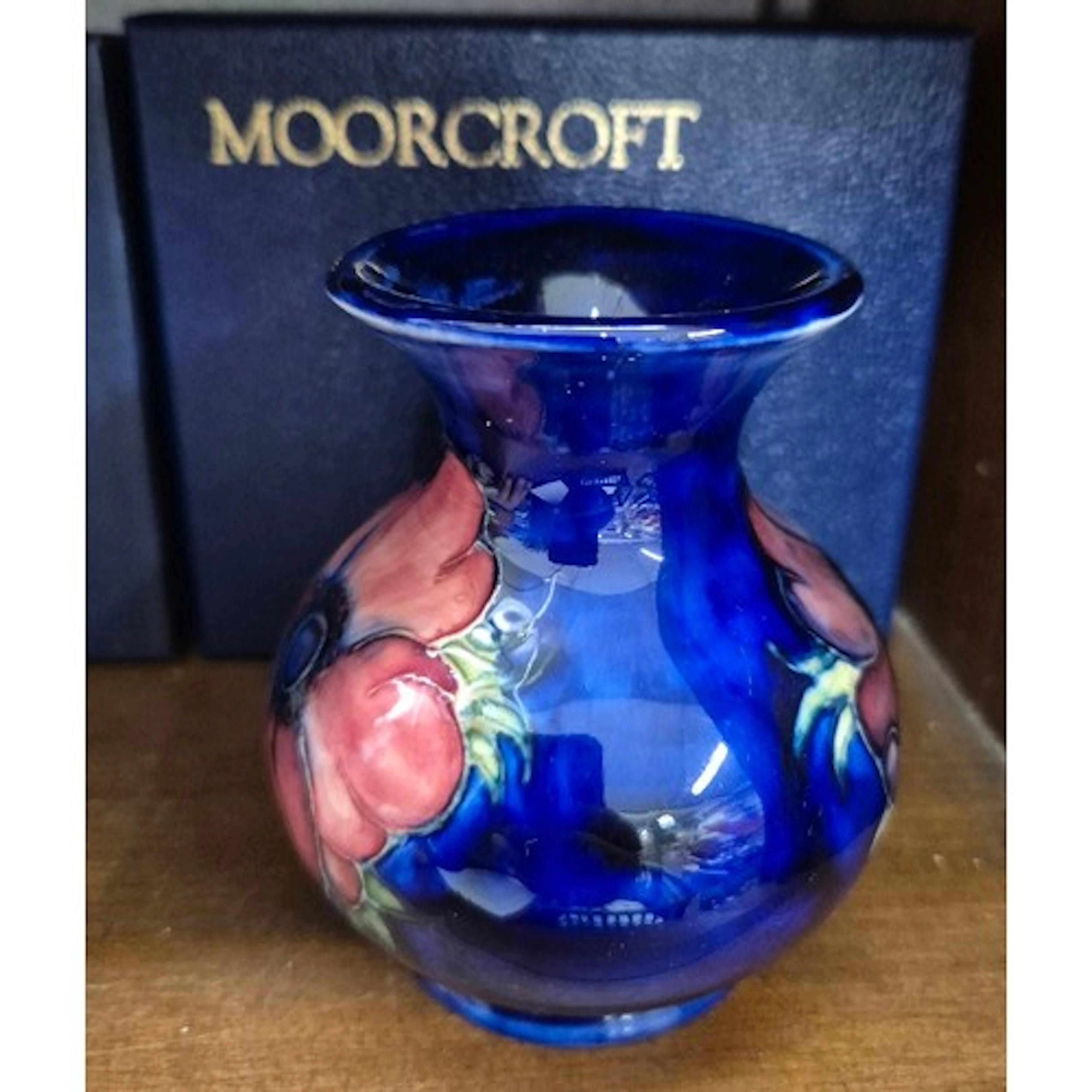 Moorcroft baluster vase, Anemoe pattern on dark blue ground,...