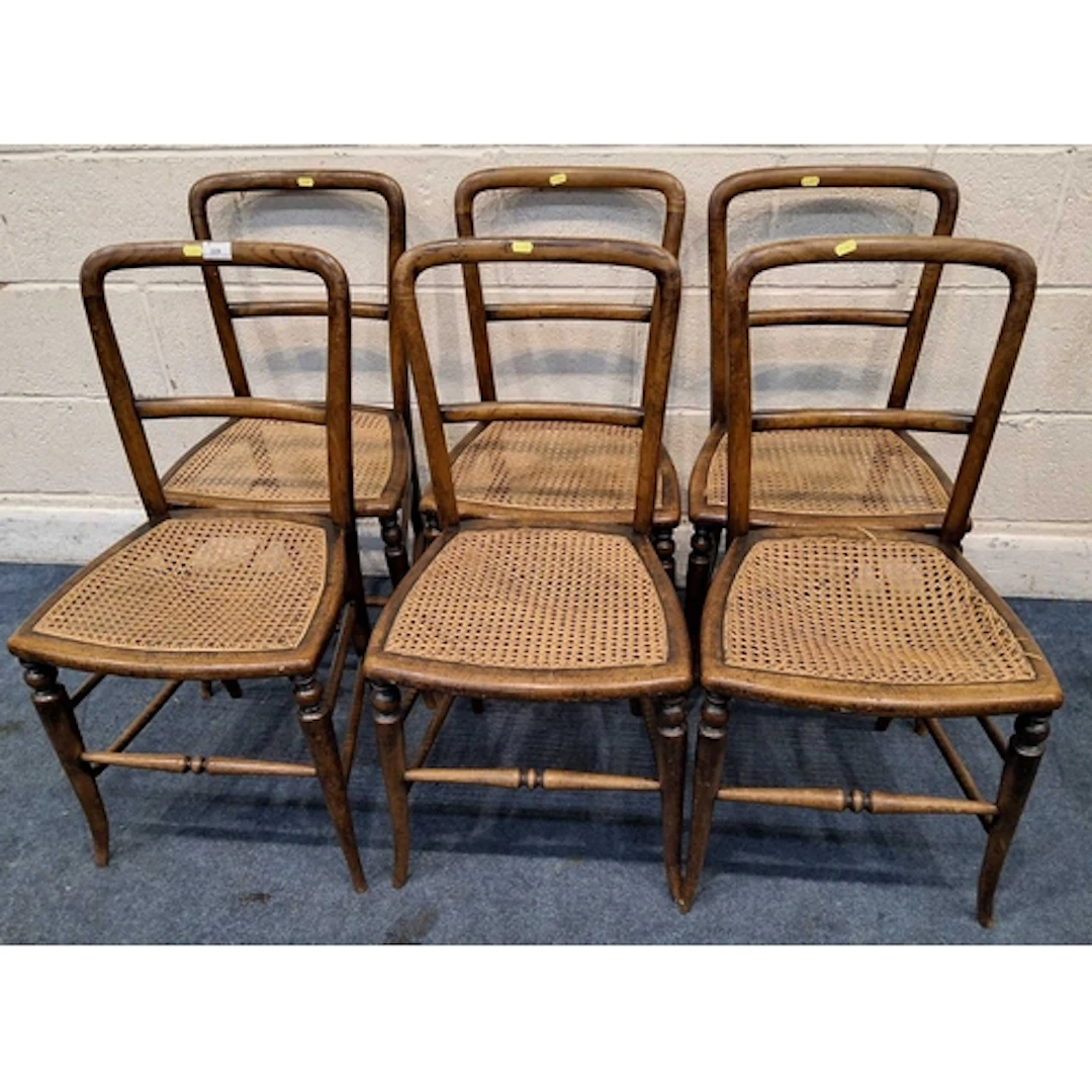 A SET OF SIX CANE SEATED CHAIRS Qty: (6) all with imperfec...