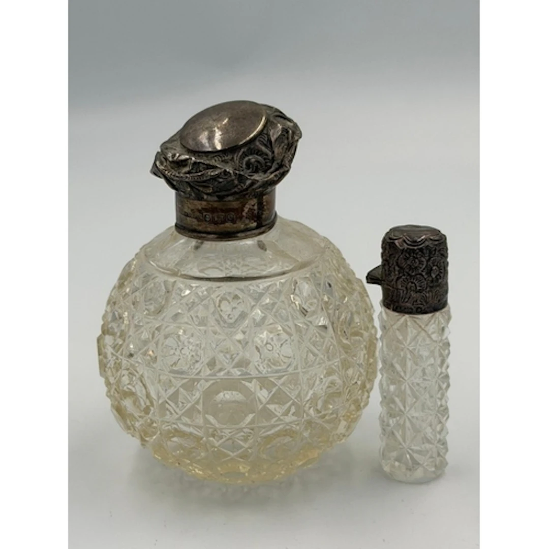 Two AF cut glass silver topped scent bottles