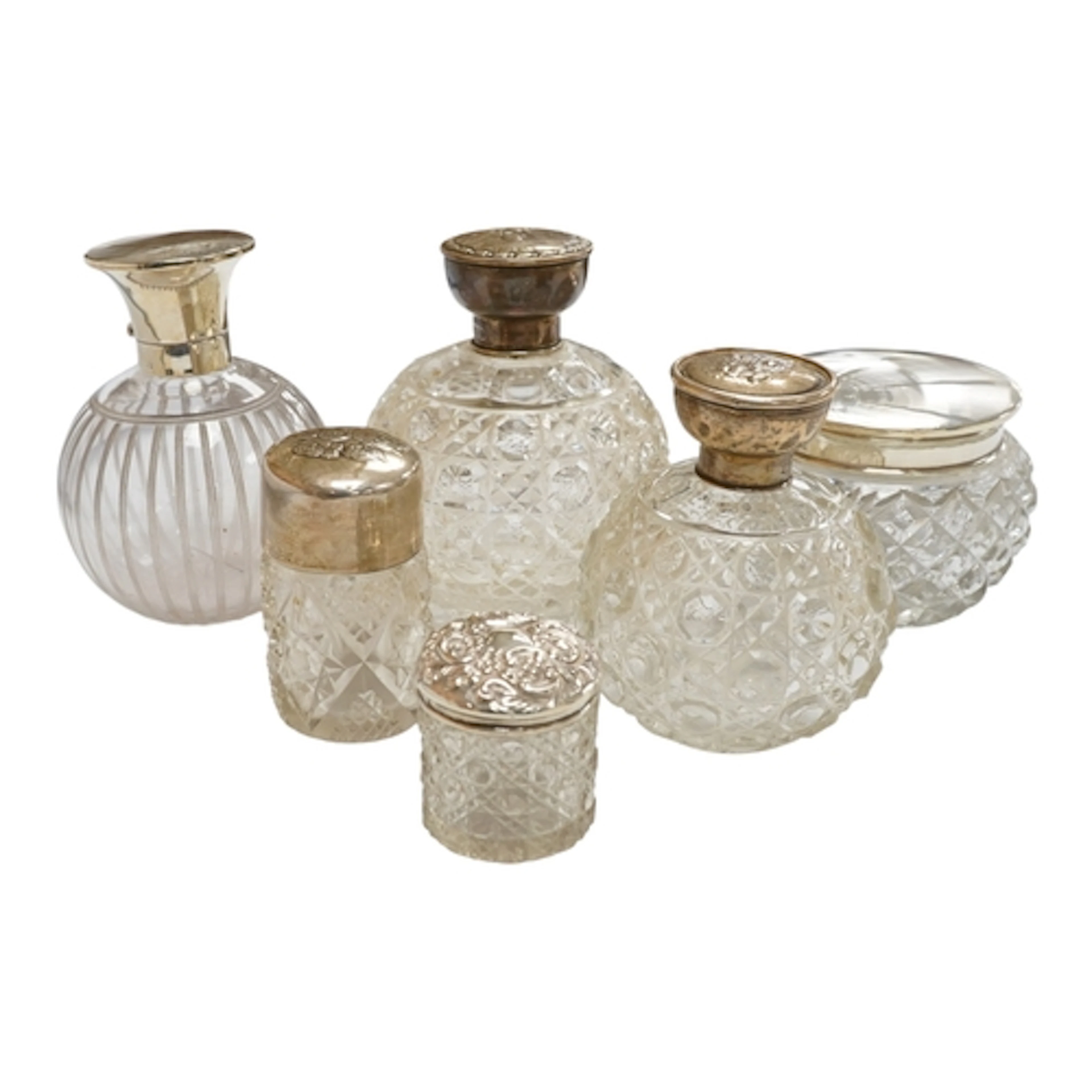 Three early 20th century silver mounted glass scent bottles ...