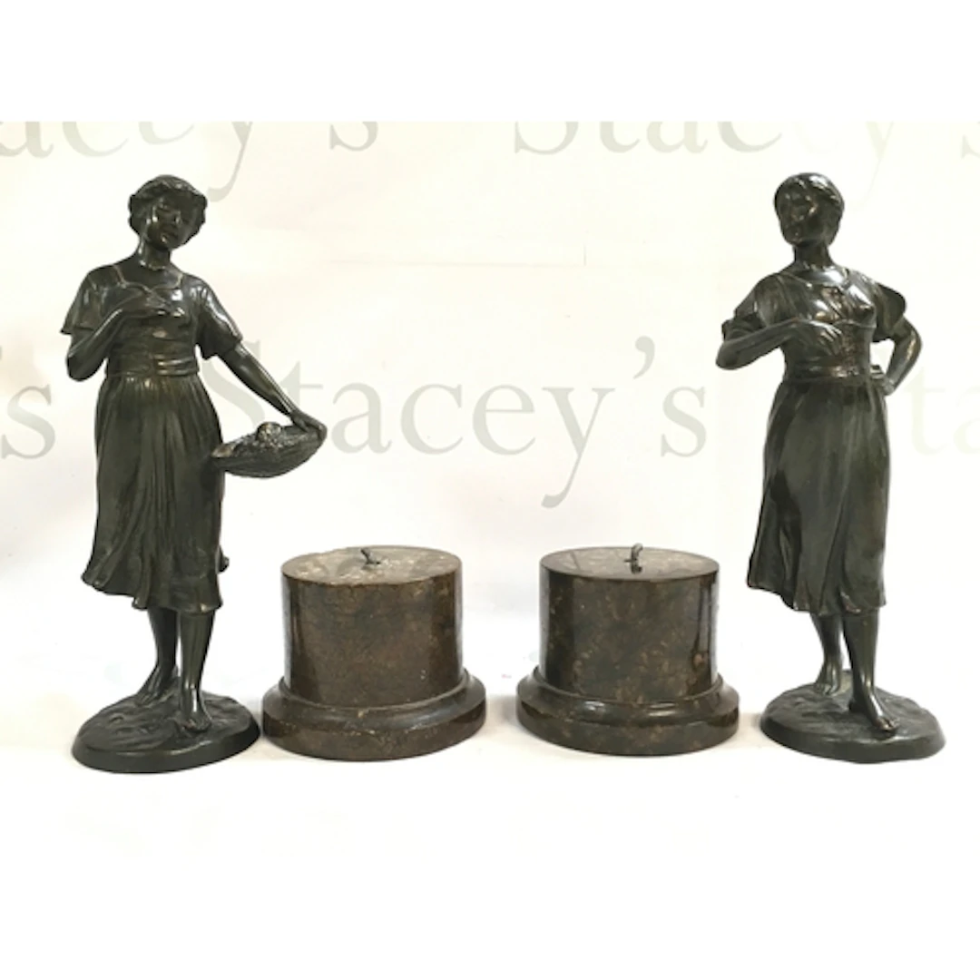 A pair of Edwardian circa 1910-20 bronze figures of two girl...