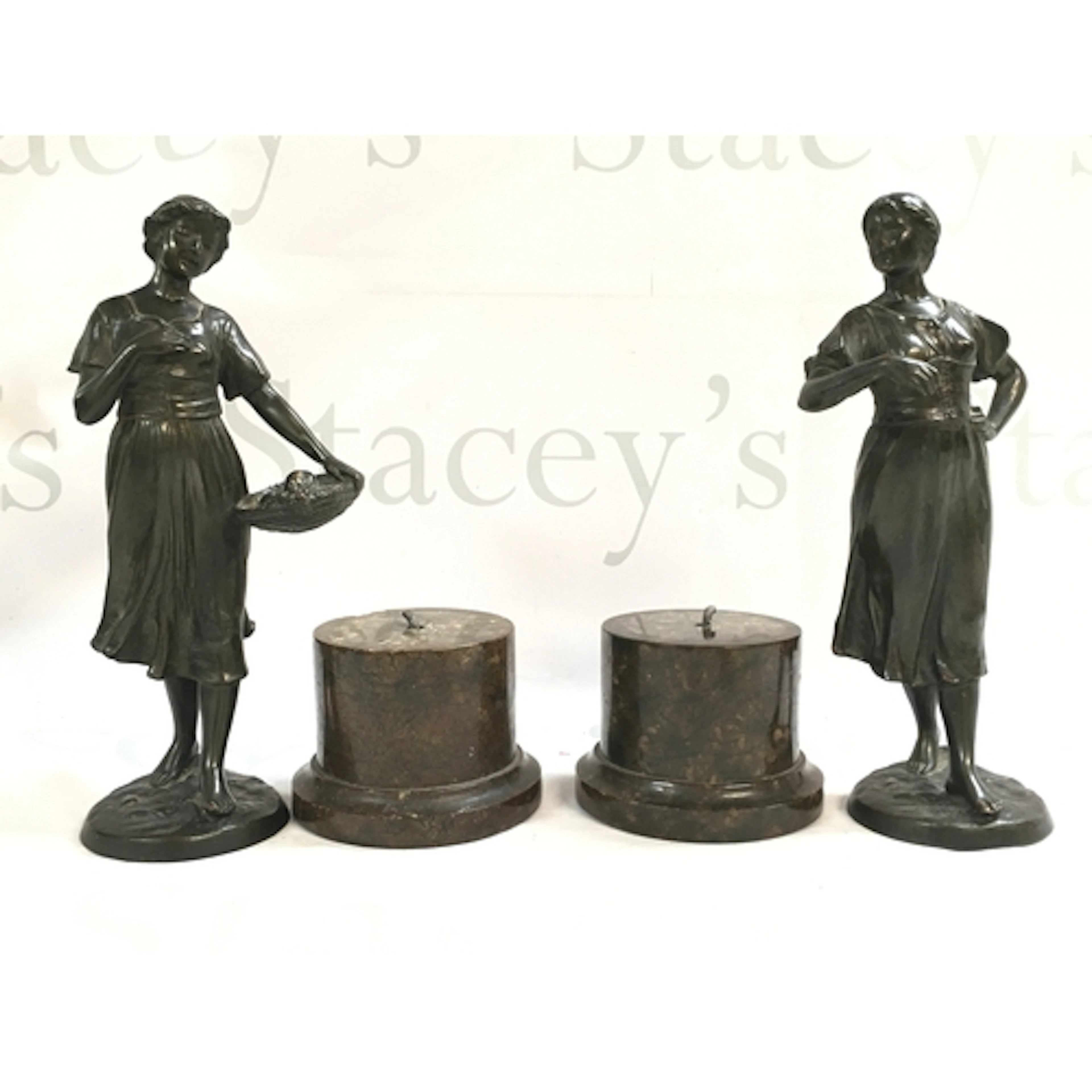 A pair of Edwardian circa 1910-20 bronze figures of two girl...