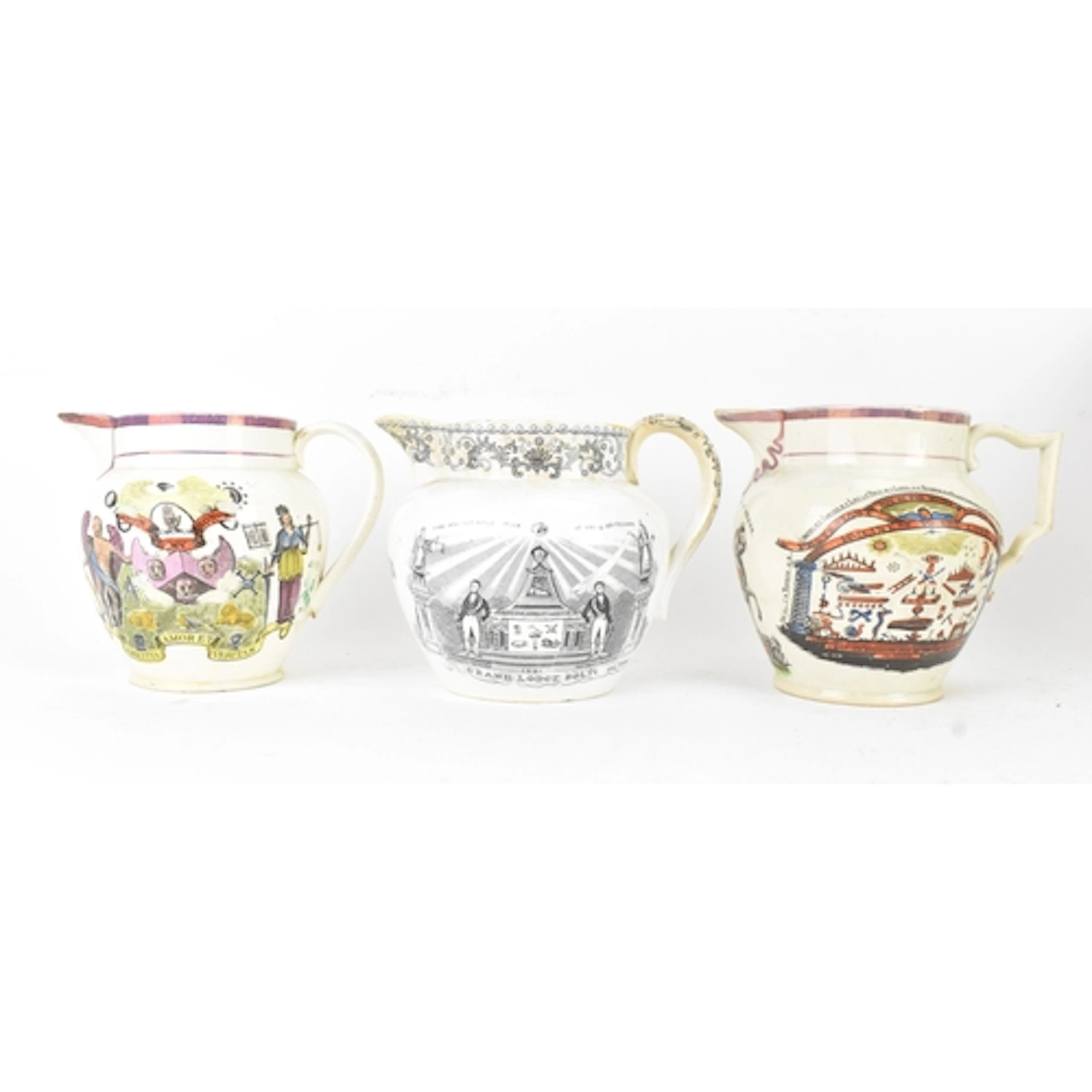 Three 19th century Masonic jugs, comprising two pink/purple ...
