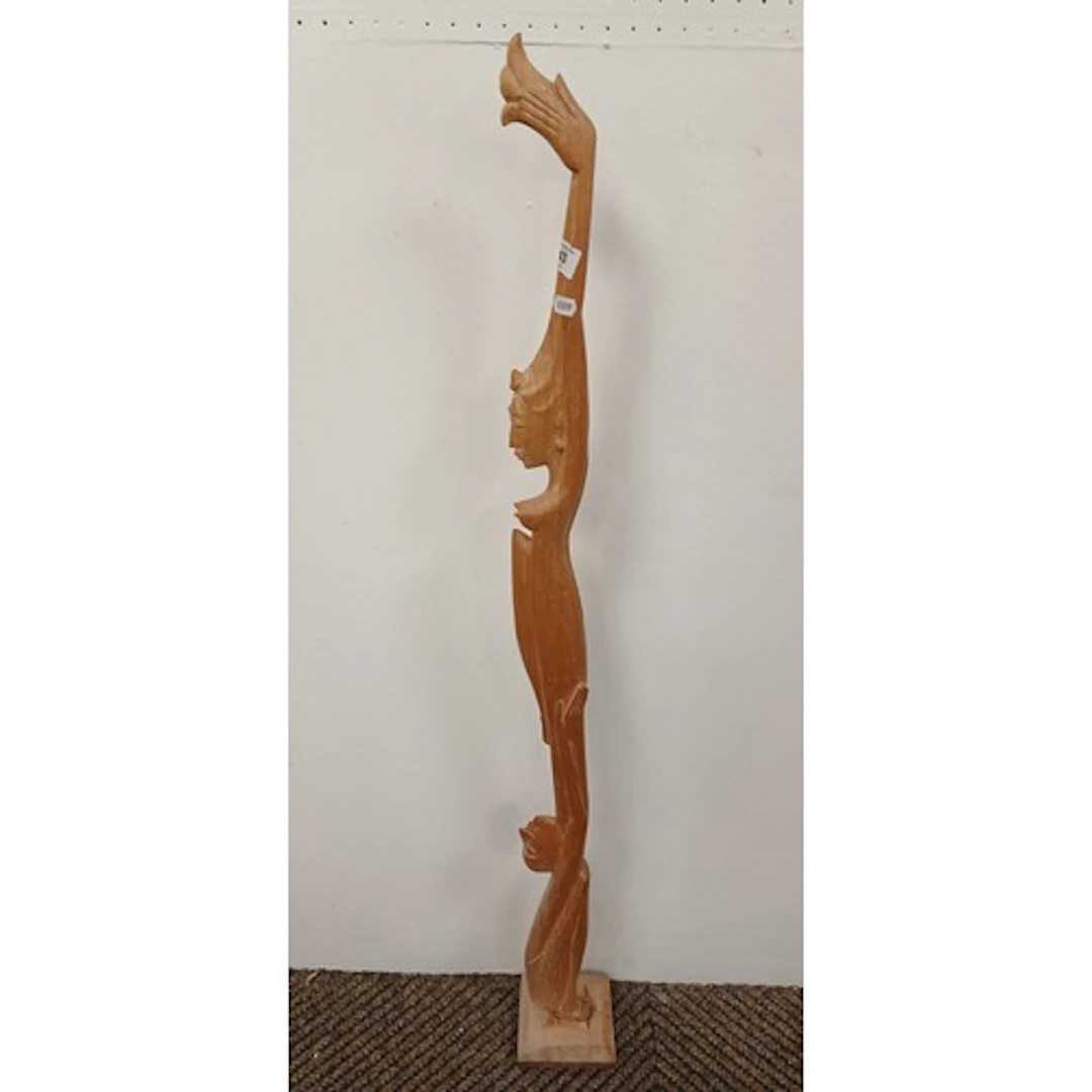 Carved tribal ceremonial staff decorated with carved figures...
