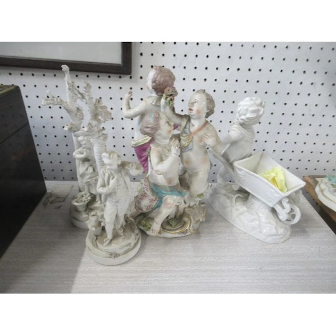 A 19th century continental porcelain figure group, together ...