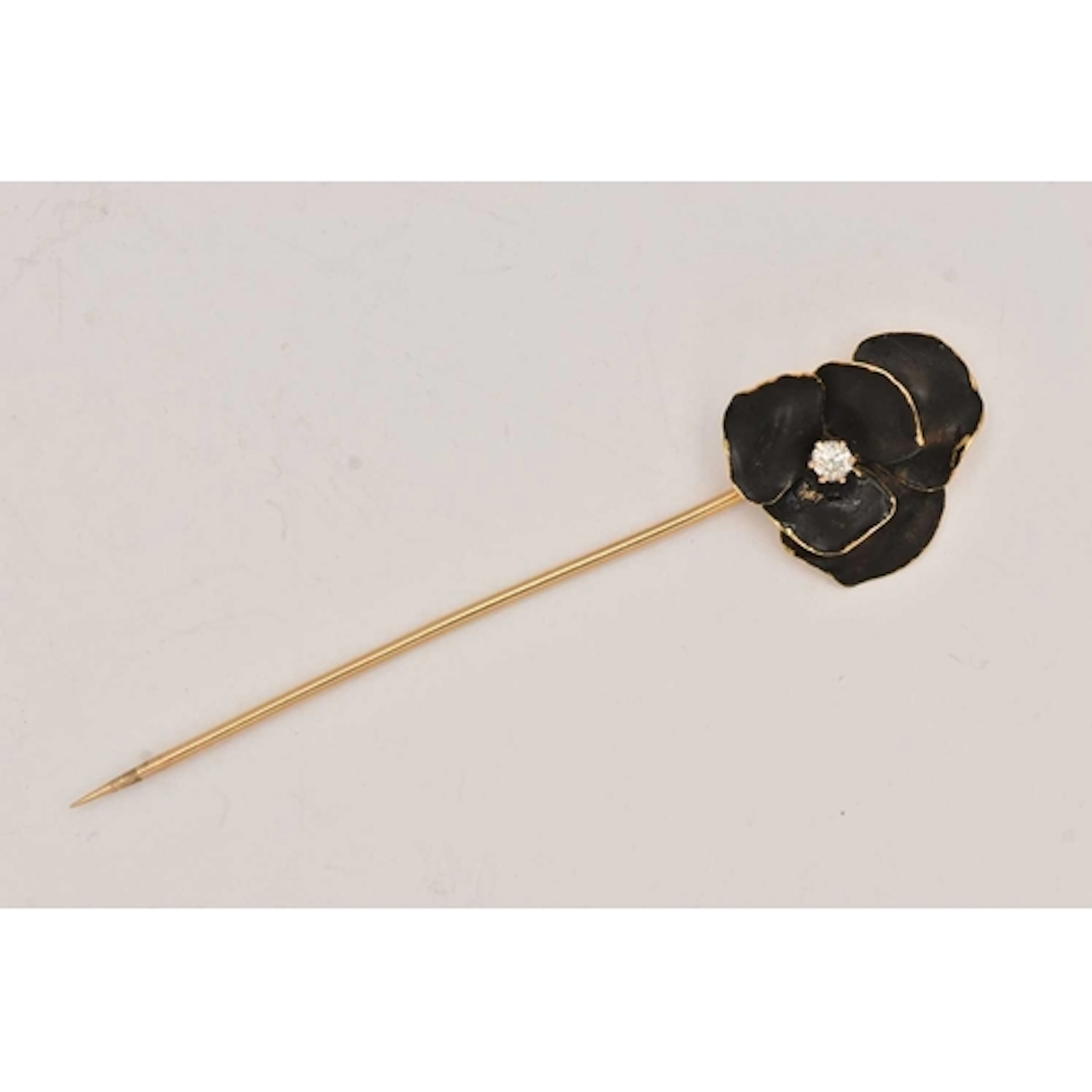 A PANSY STICK PIN, yellow metal stick pin with matt black en...