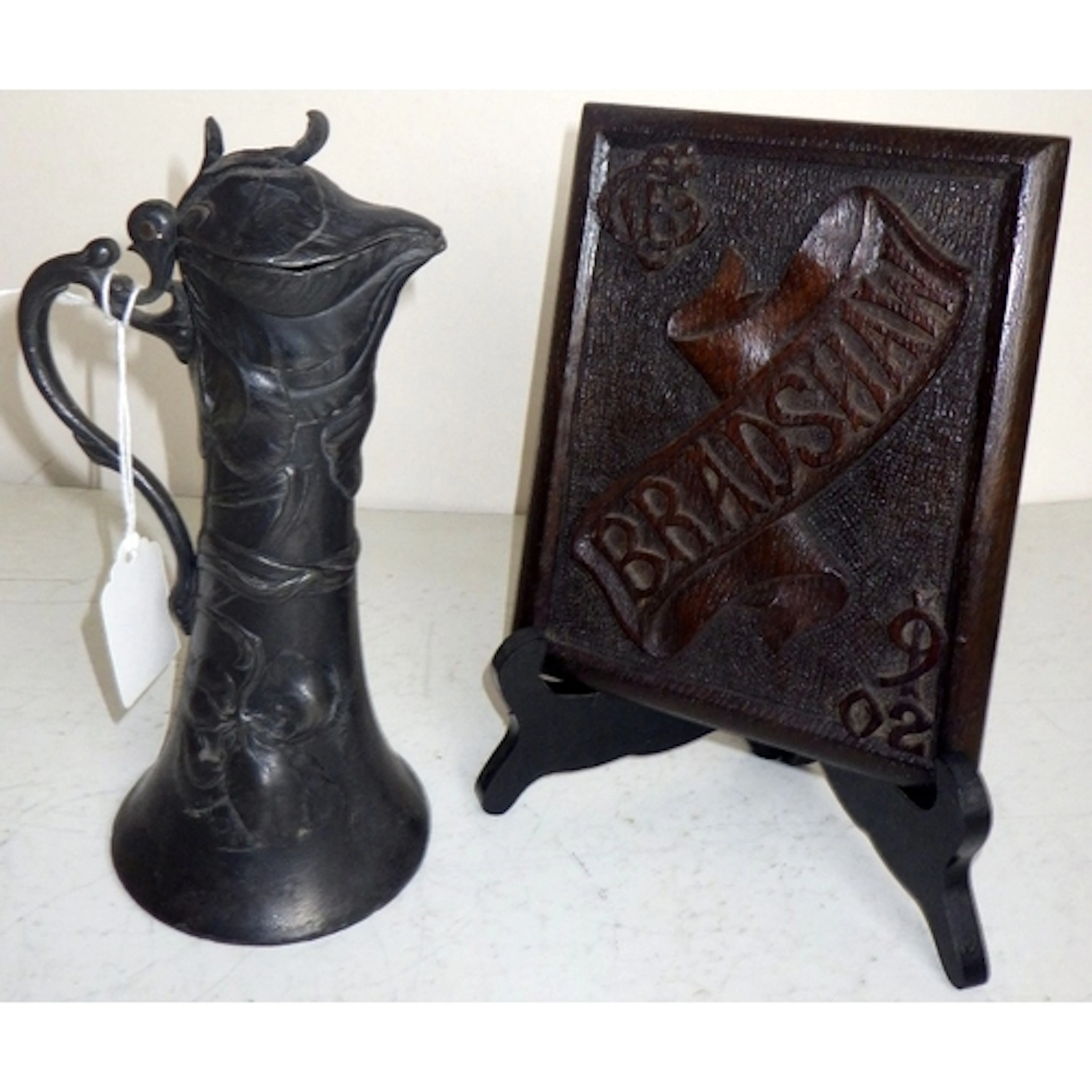 An Art Nouveau pewter lidded jug, 22cm tall, together with a...
