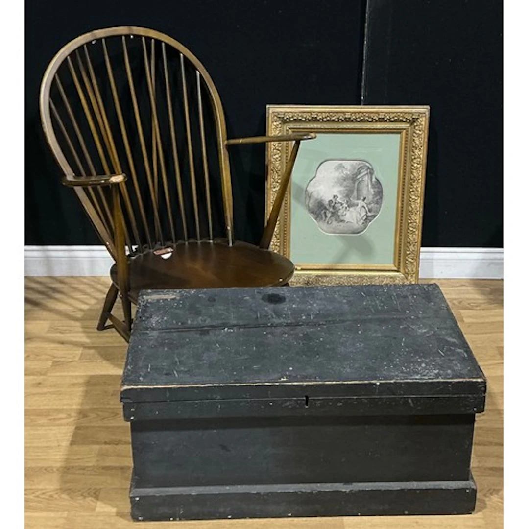 An Ercol armchair; an ebonised carpenter’s tool chest, 81.5c...