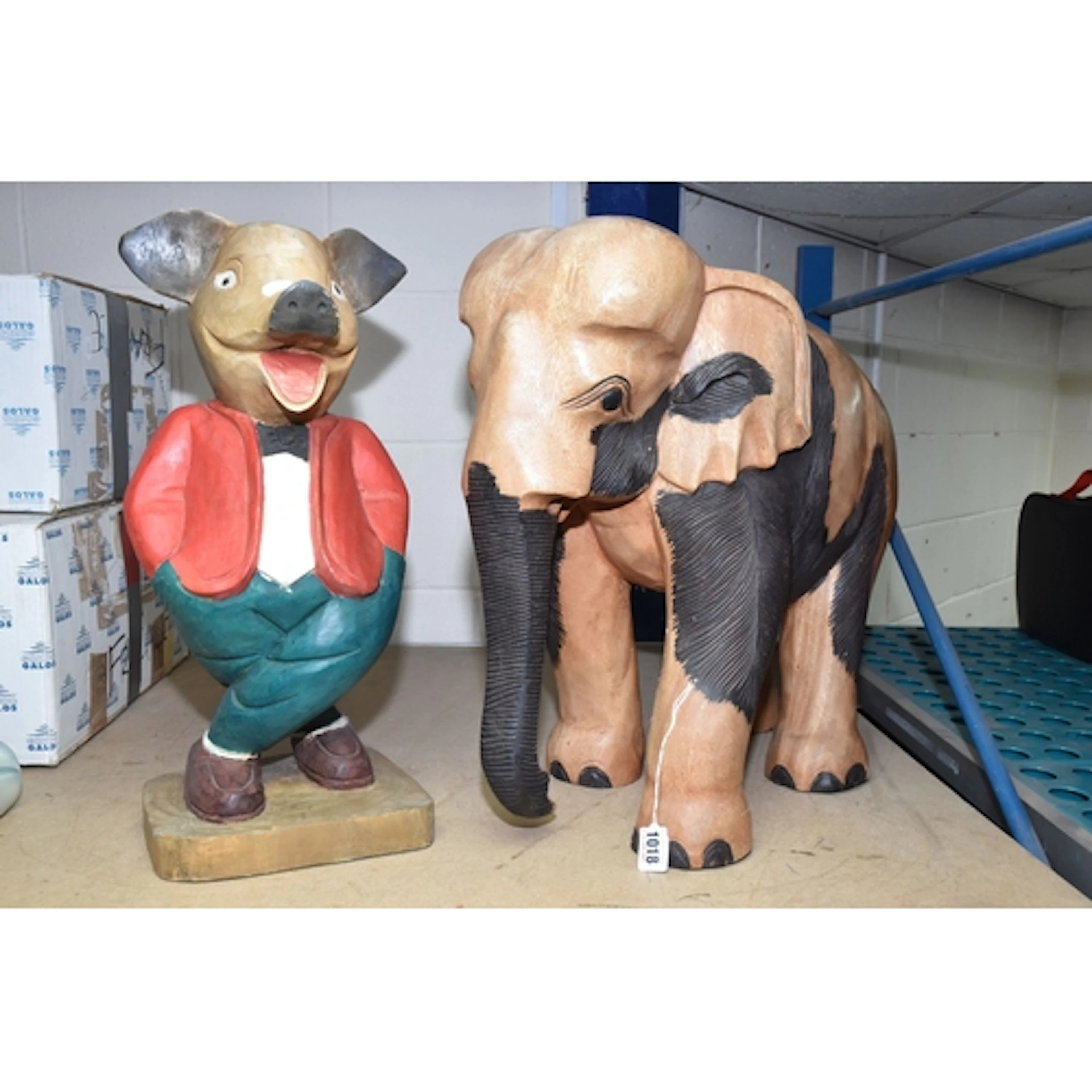 TWO VINTAGE WOODEN CARVED SCULPTURES, one depicting a pig in...
