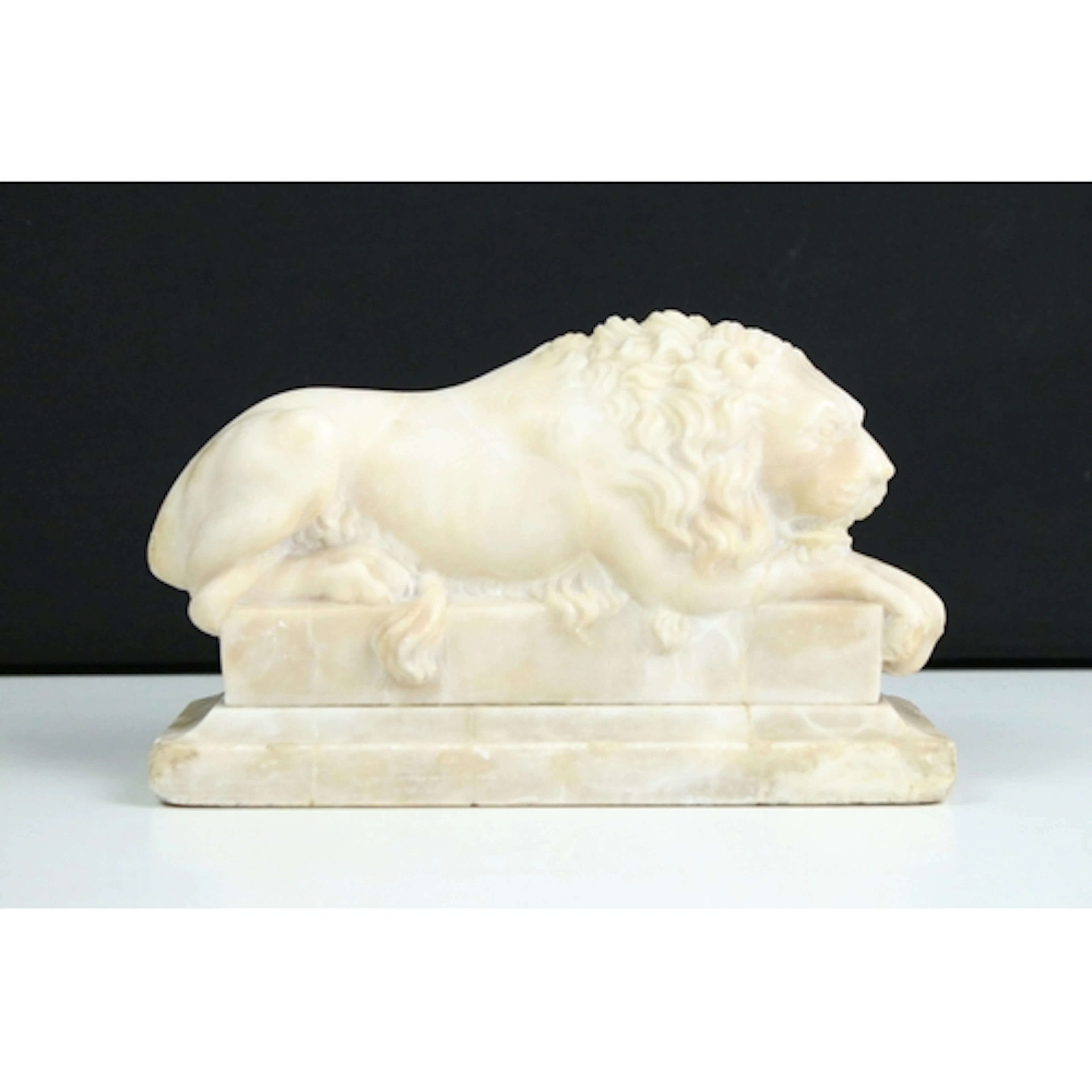 Late 19th/20th century carved alabaster sculpture of a recum...
