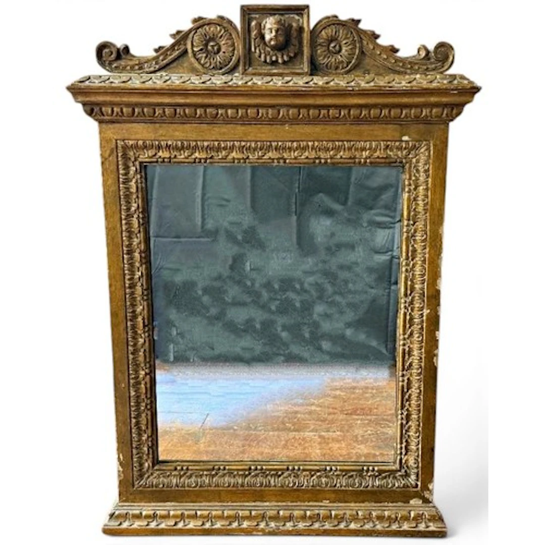 An 18th century carved wood and gilt gesso hanging wall mirr...