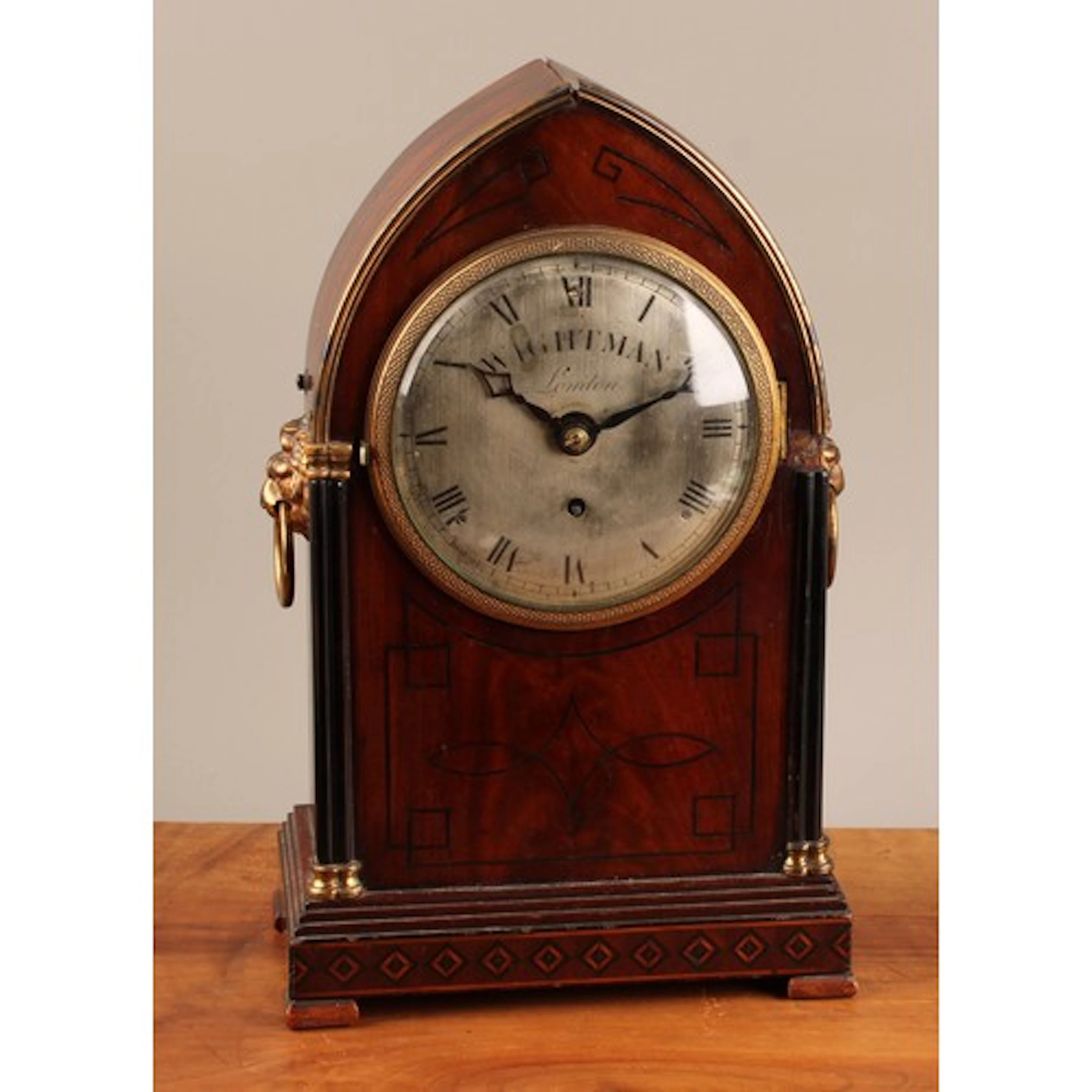 A 19th century mahogany lancet shaped bracket timepiece, 12....