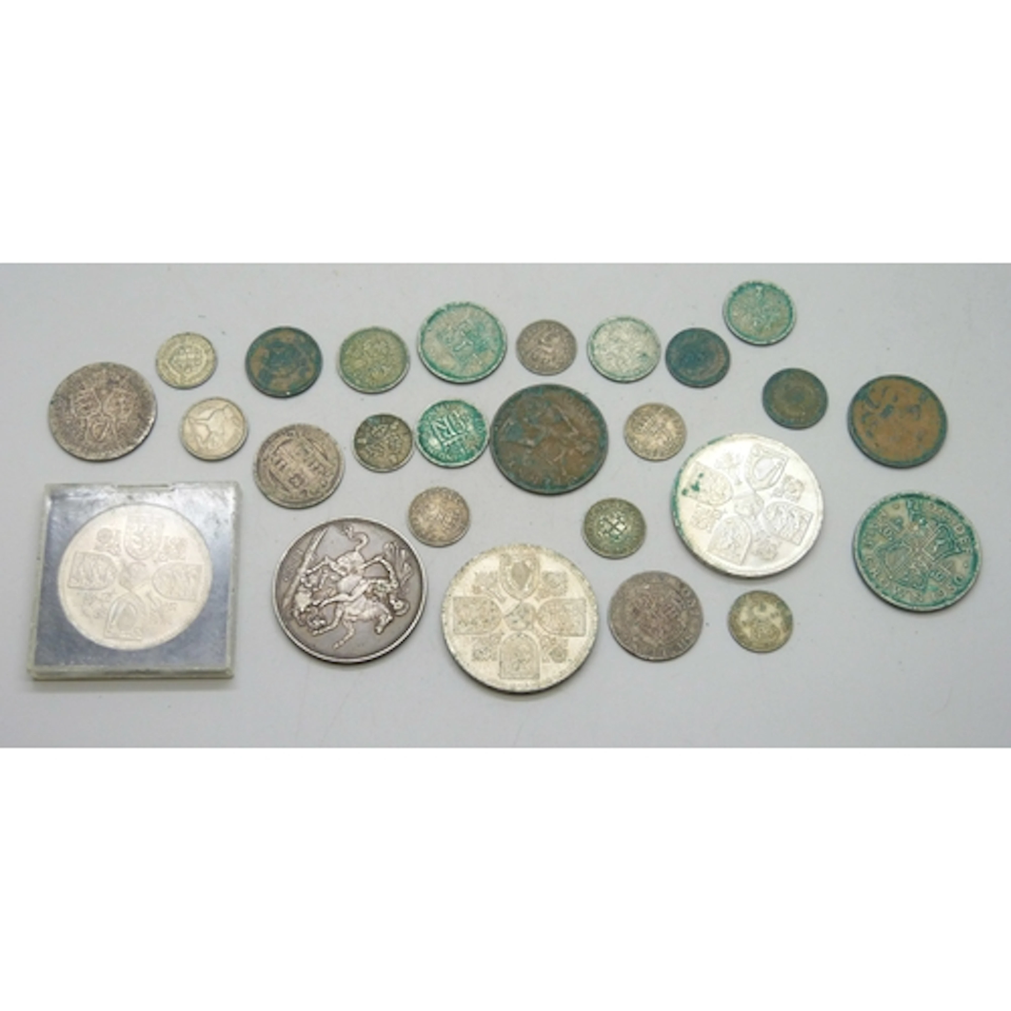 A collection of coins including an 1889 Victorian silver cro...