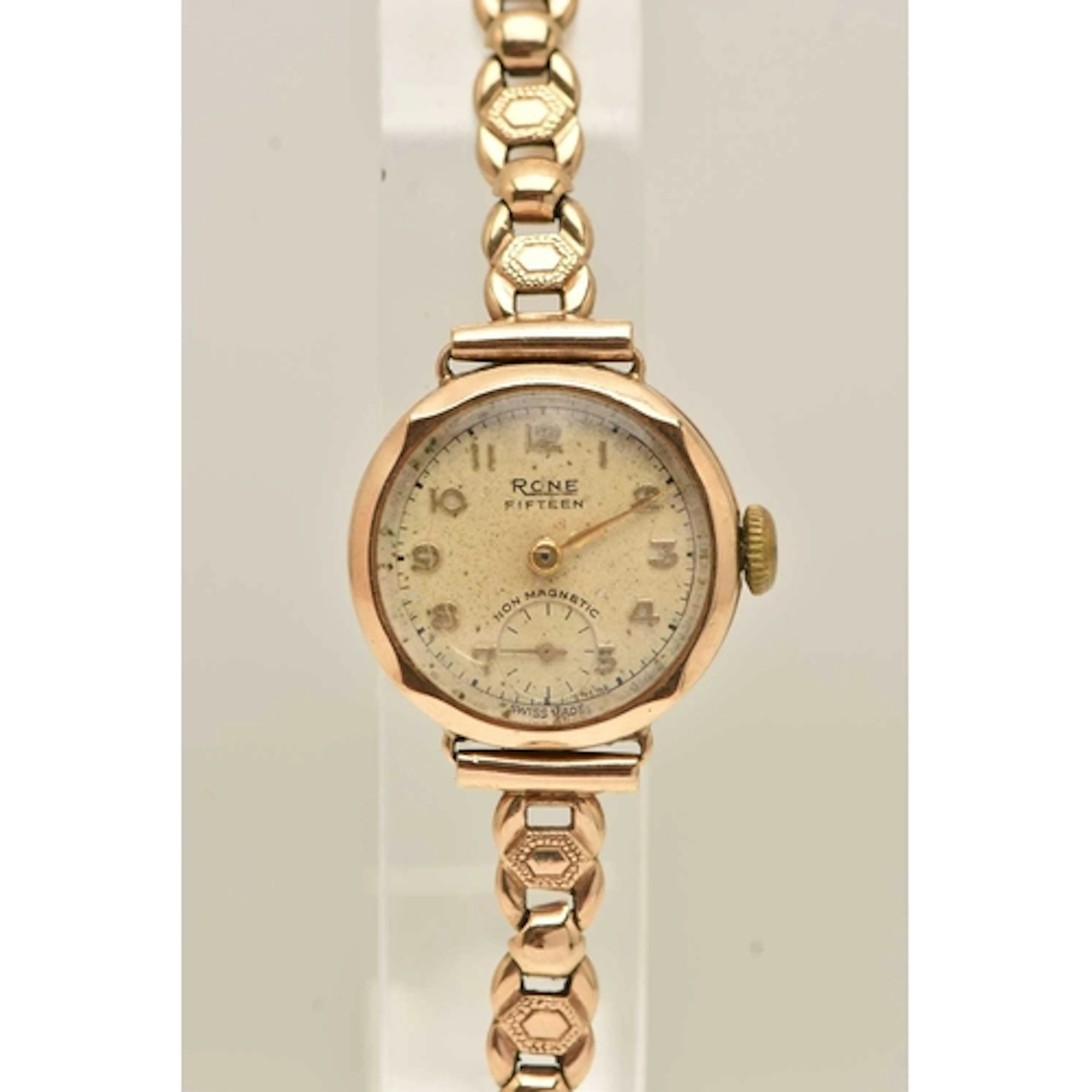 A 9CT GOLD 'RONE' WRISTWATCH, manual wind, round silver dial...