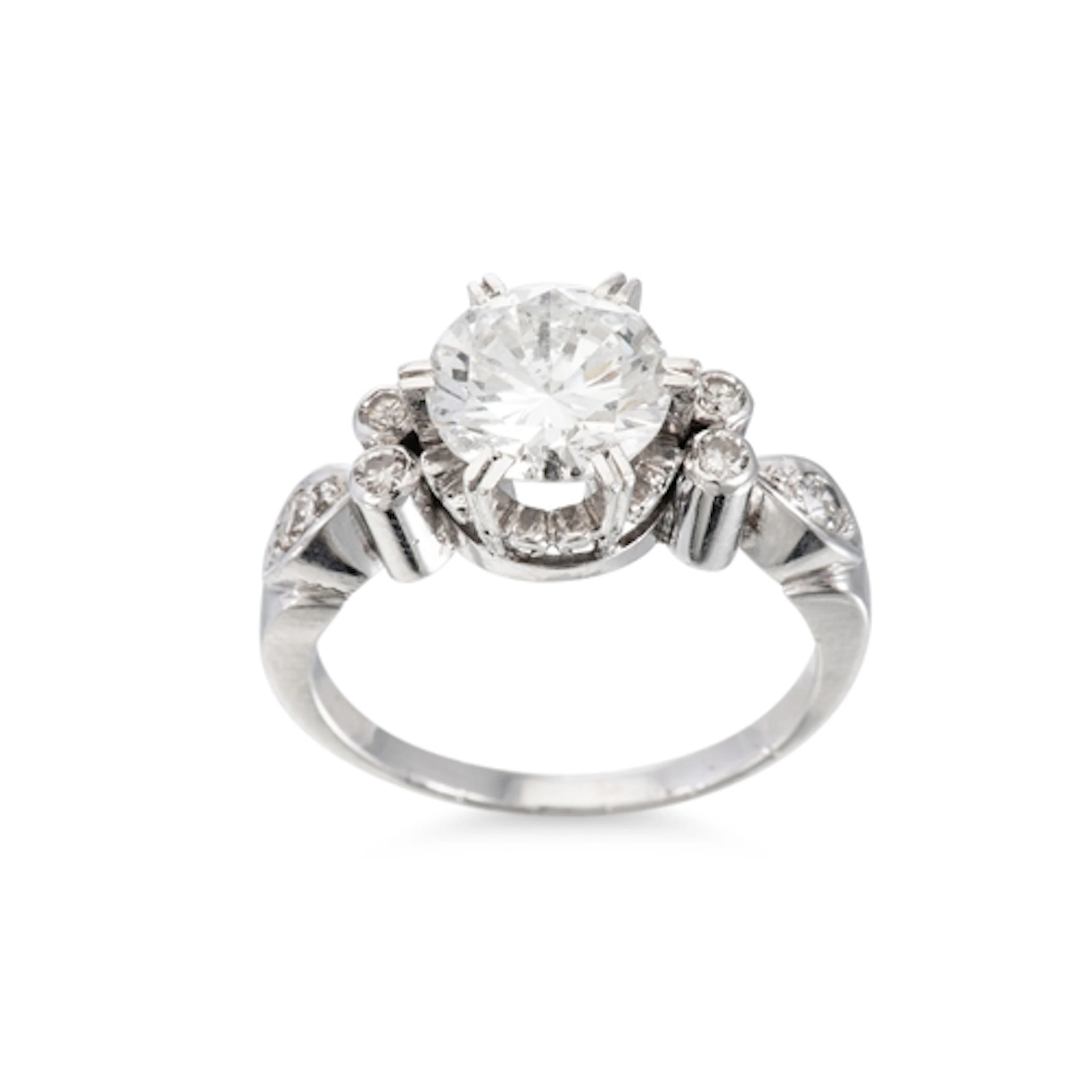 A VINTAGE DIAMOND SOLITAIRE RING, the principal round cut di...