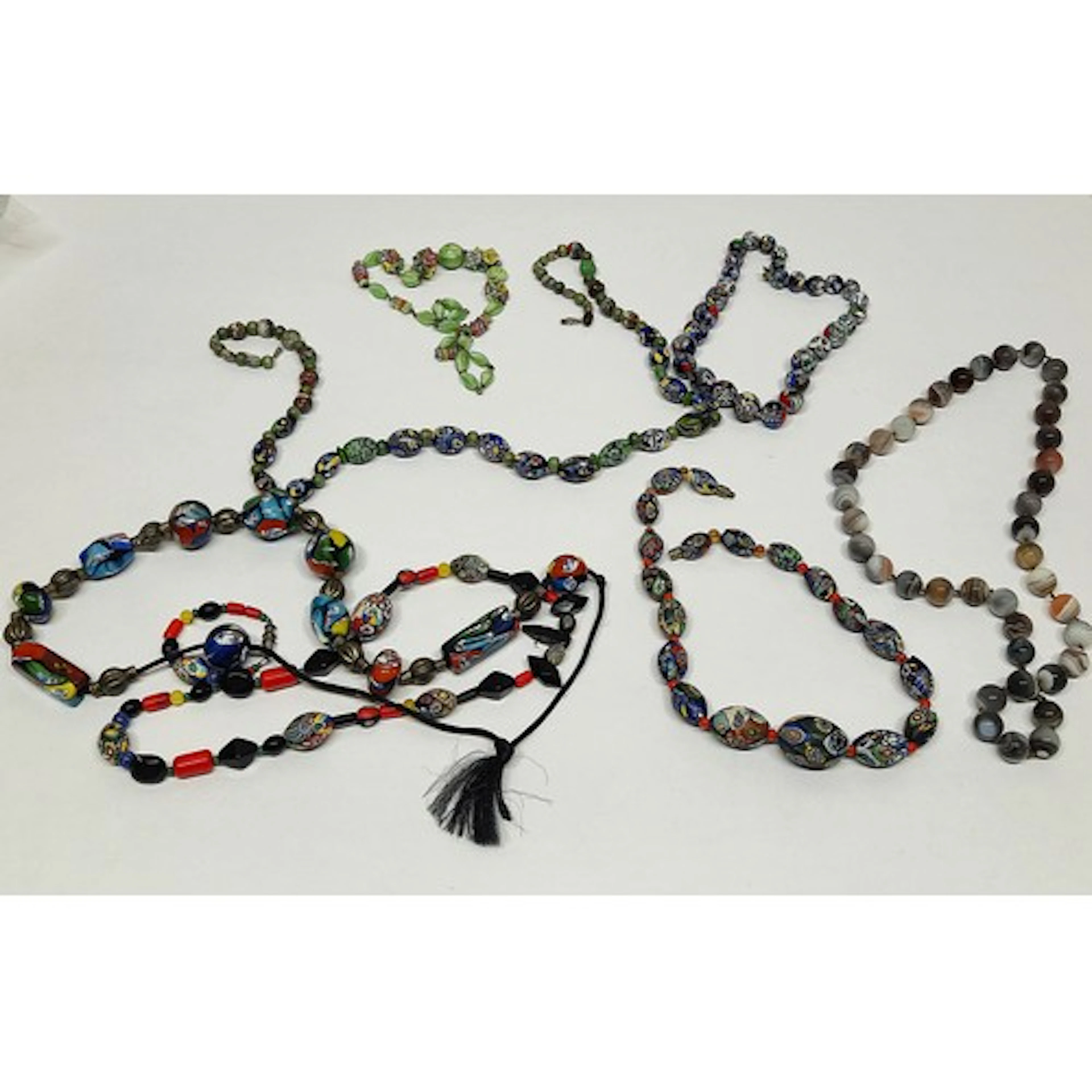 Group of strings of Murano style bead necklaces, and string ...