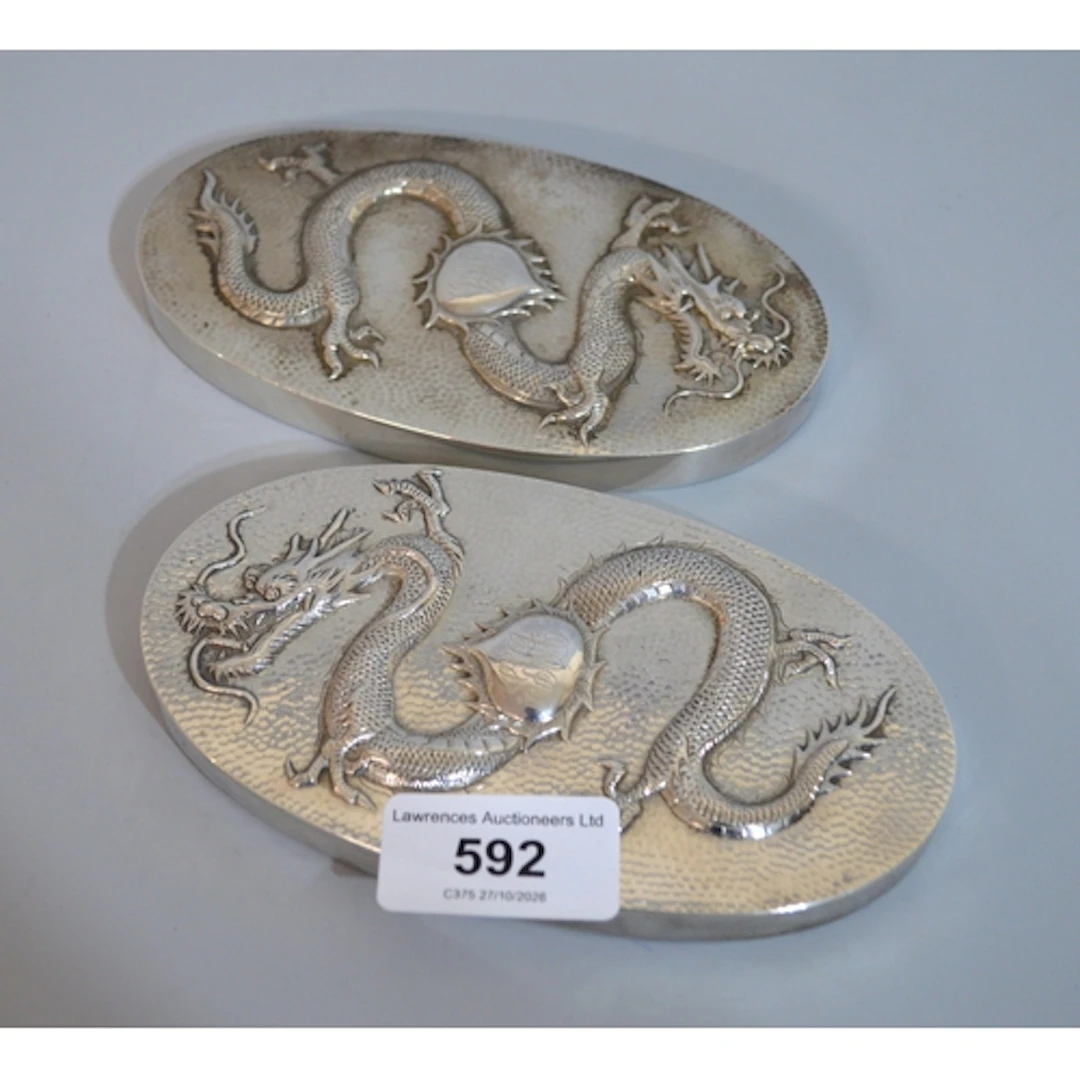 Pair of Chinese silver hairbrush backs, relief decorated wit...