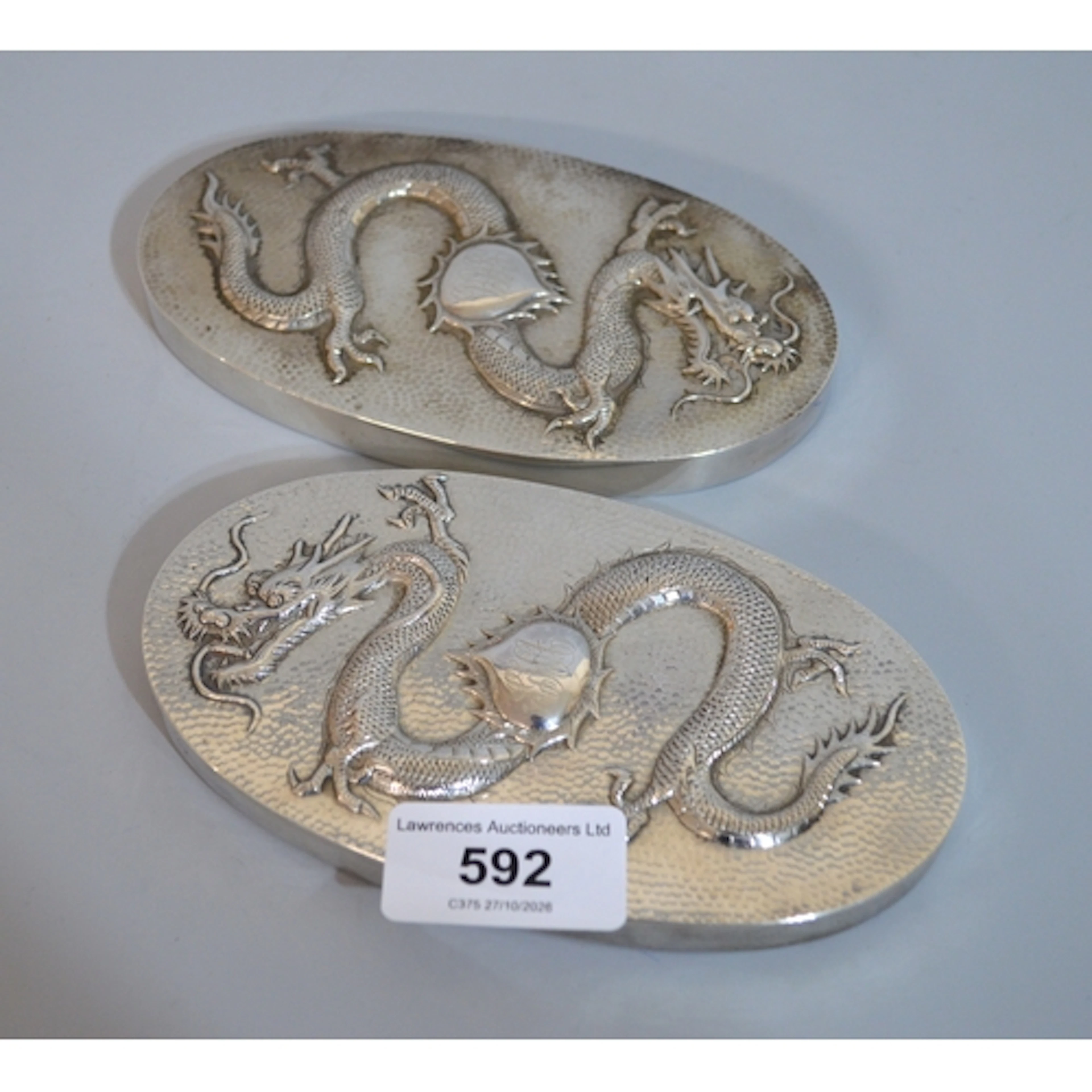 Pair of Chinese silver hairbrush backs, relief decorated wit...