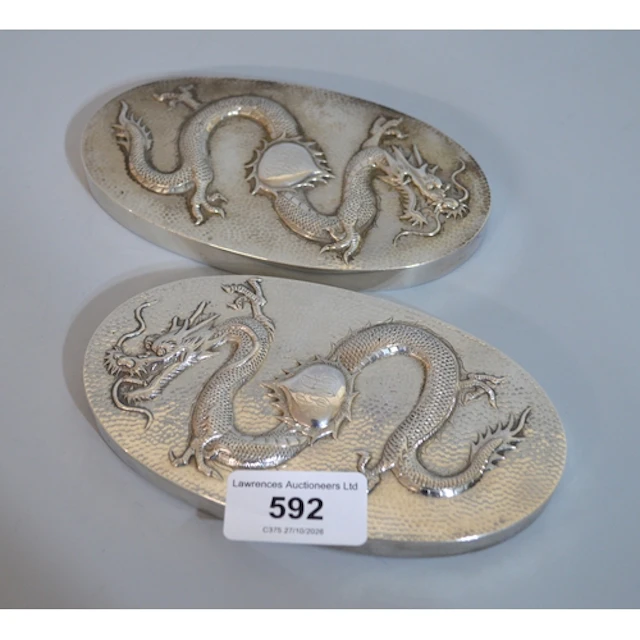 Pair of Chinese silver hairbrush backs, relief decorated wit...