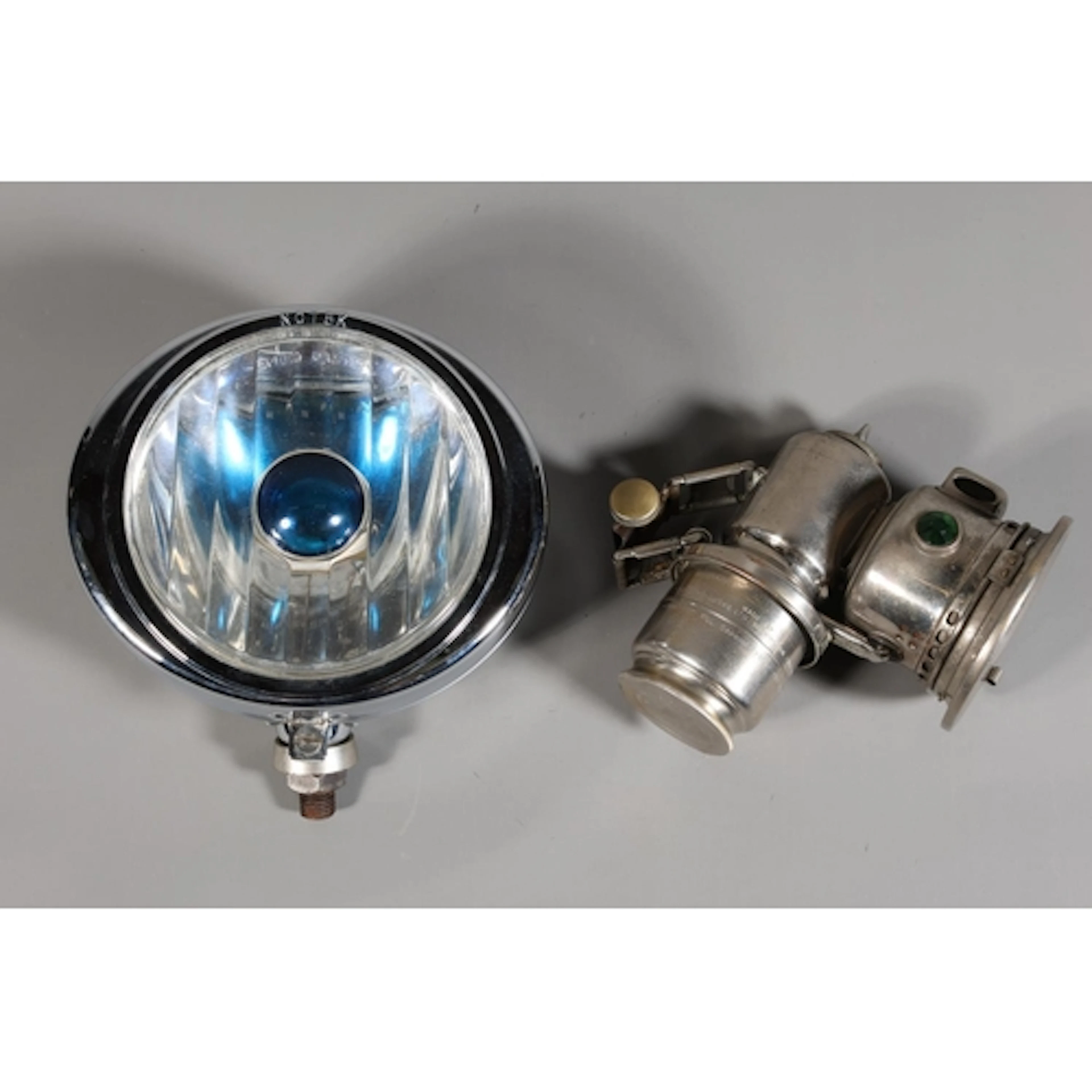 Notek car lamp of oval form with blue central glass and a Lu...