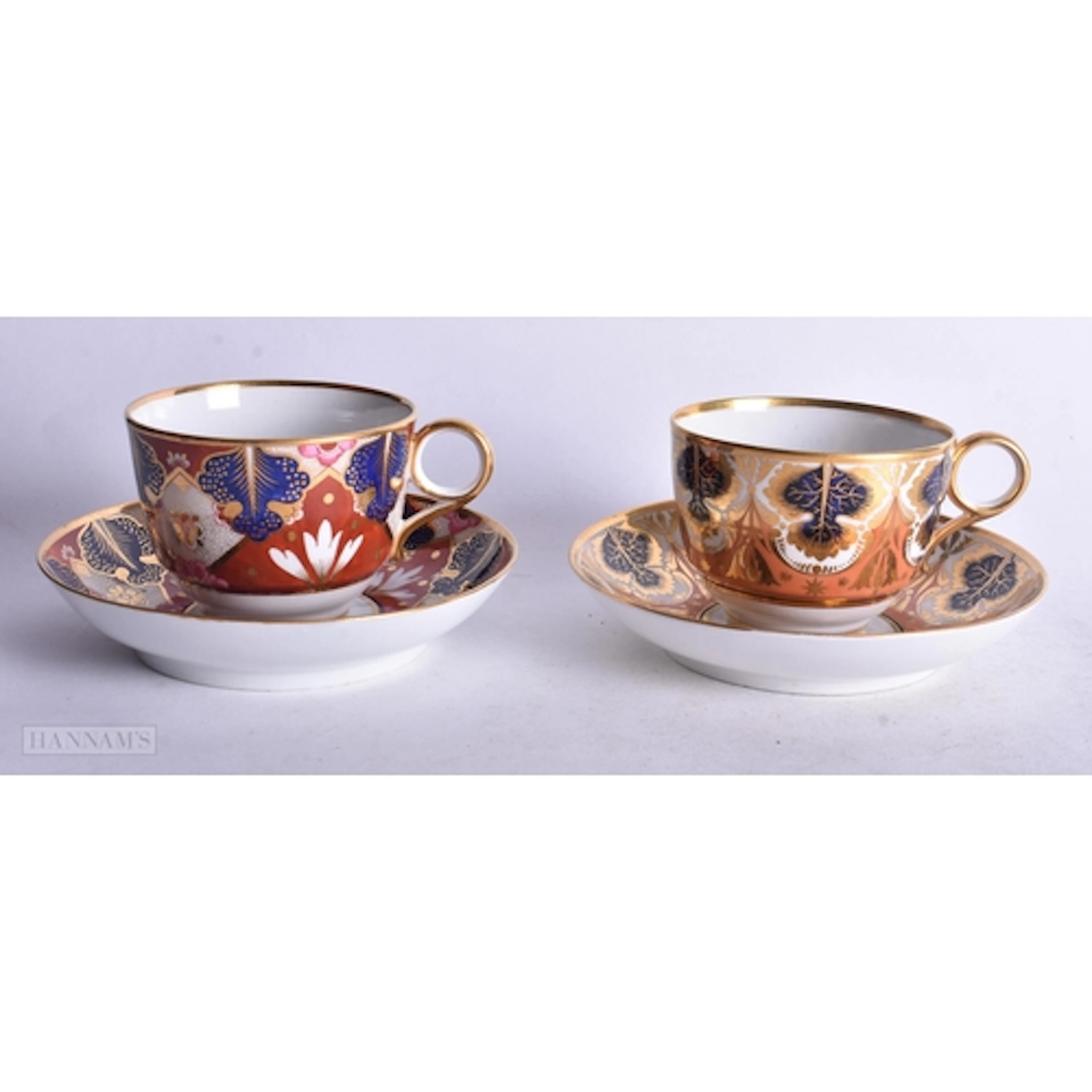 Two Flight Barr and Barr cups and saucers in imari style, 14...