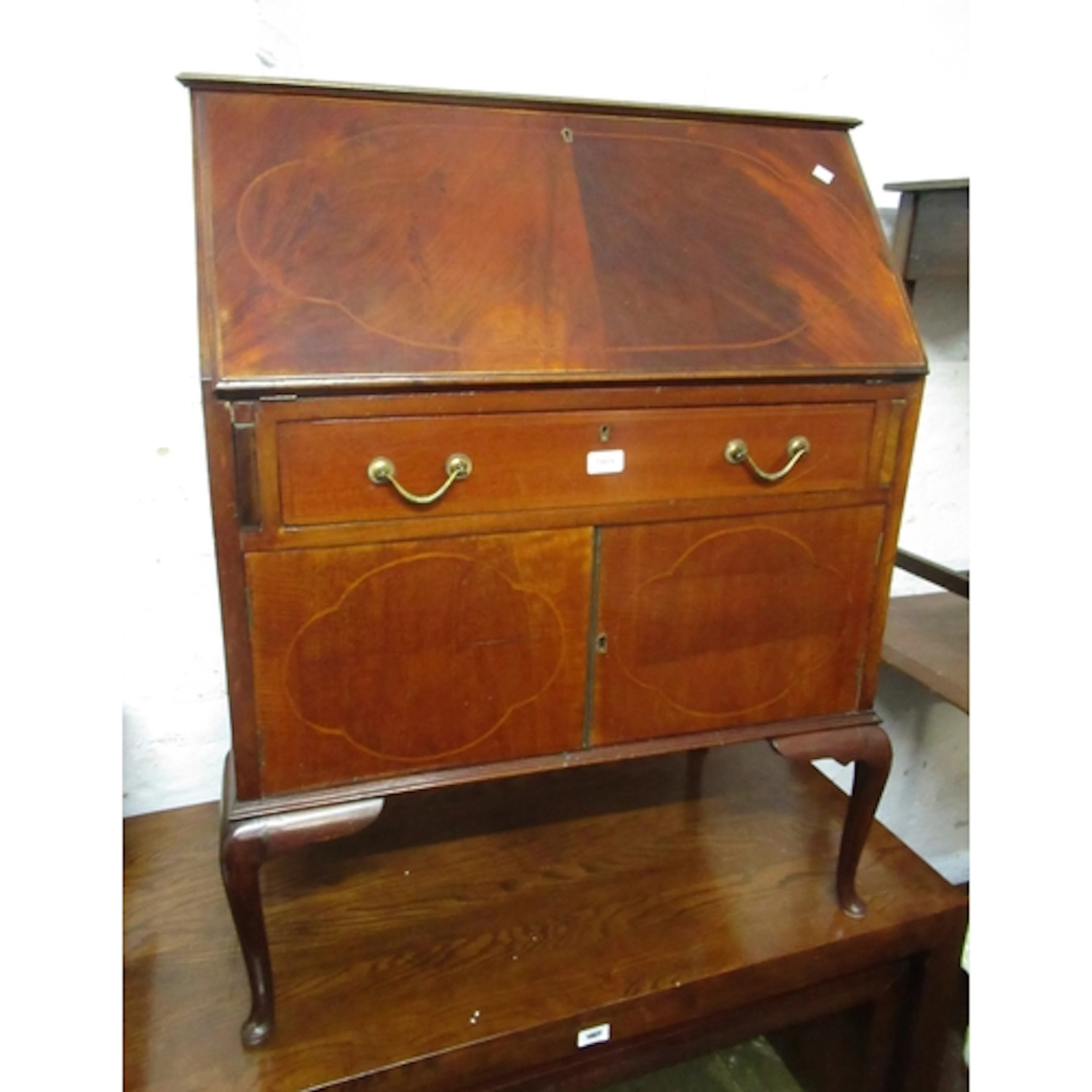 Edwardian mahogany and line inlaid bureau, with a fall front...