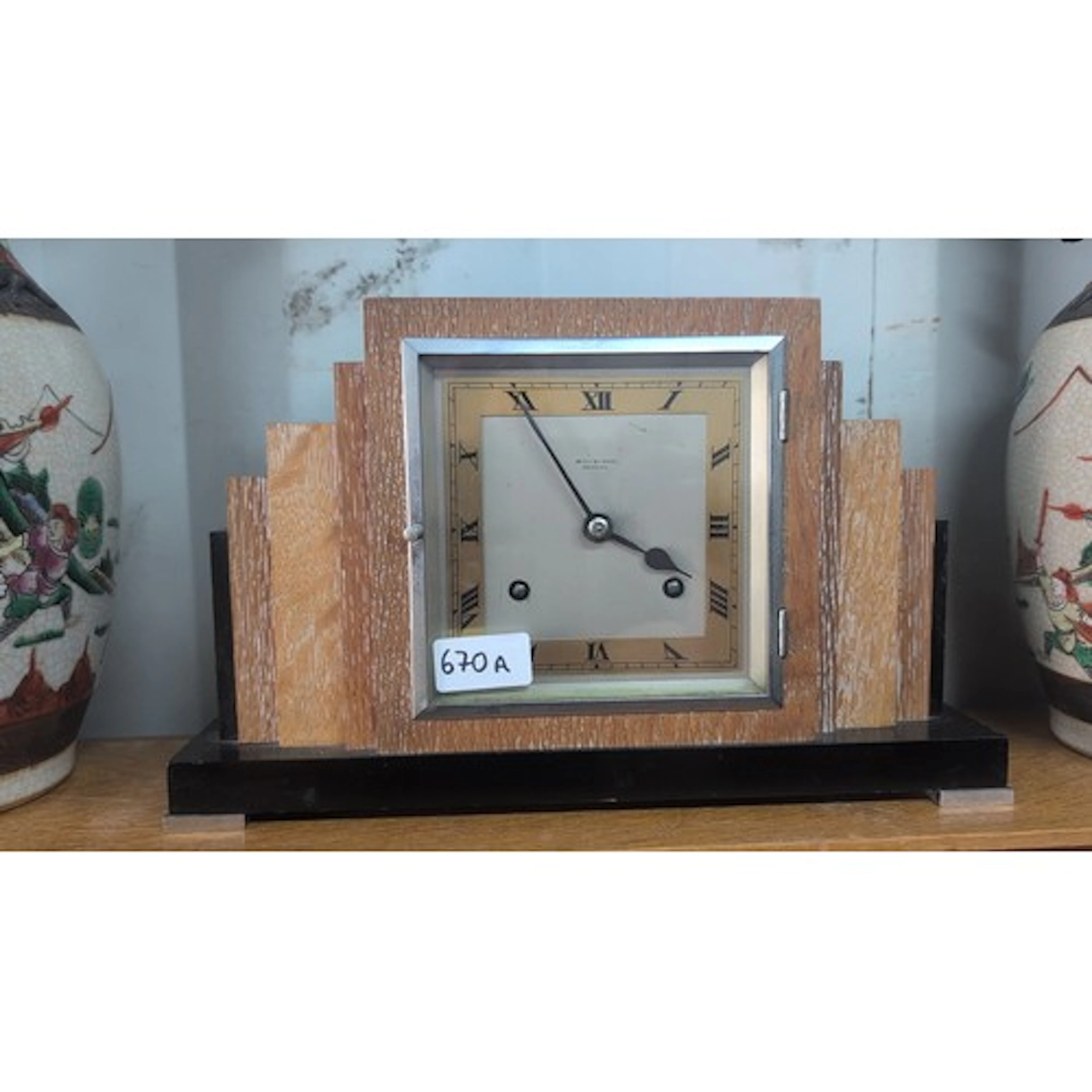 Art Deco oak-cased mantel clock with stepped shoulders, squa...