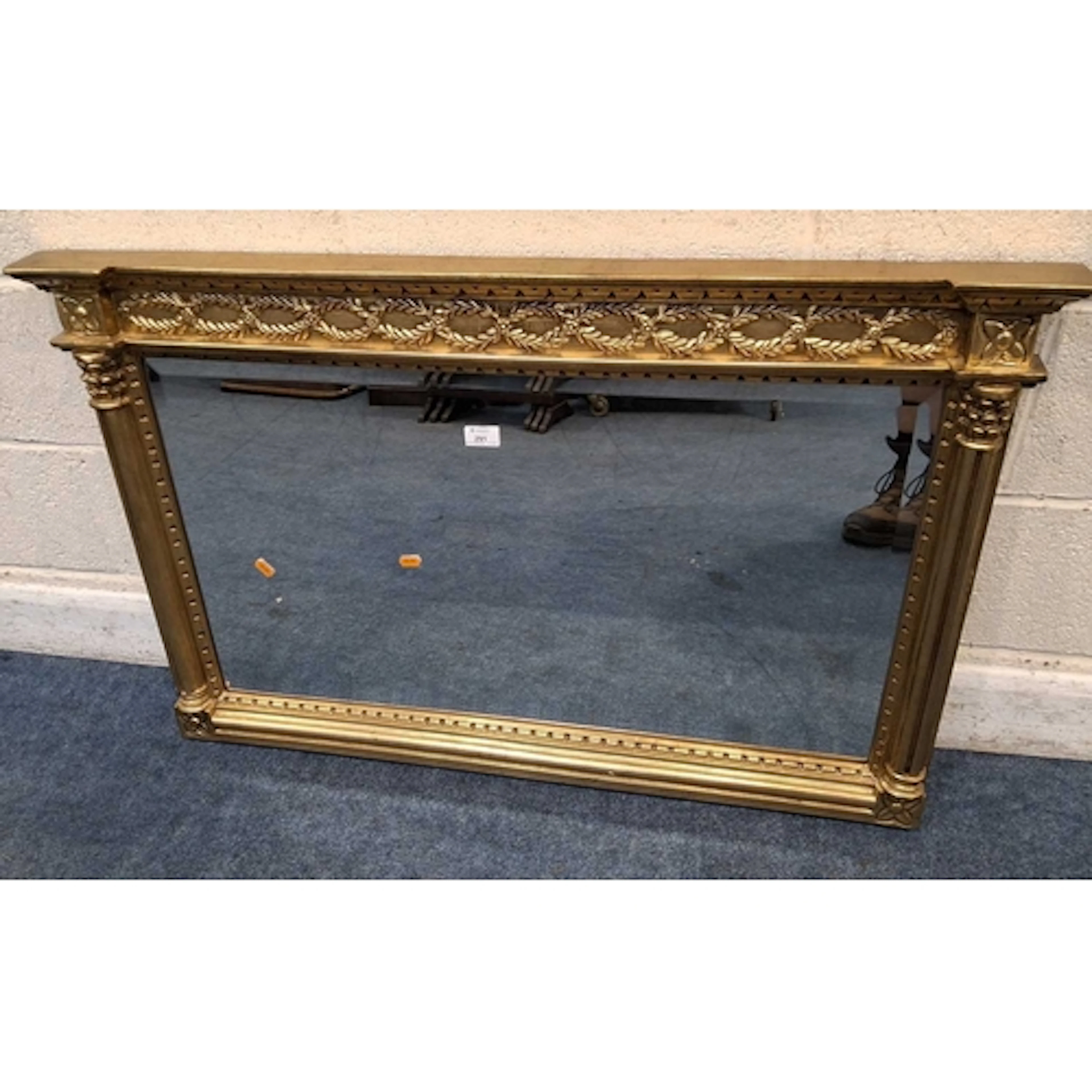 A GILT FRAME BEVELLED EDGE OVERMANTEL MIRROR, with repeating...
