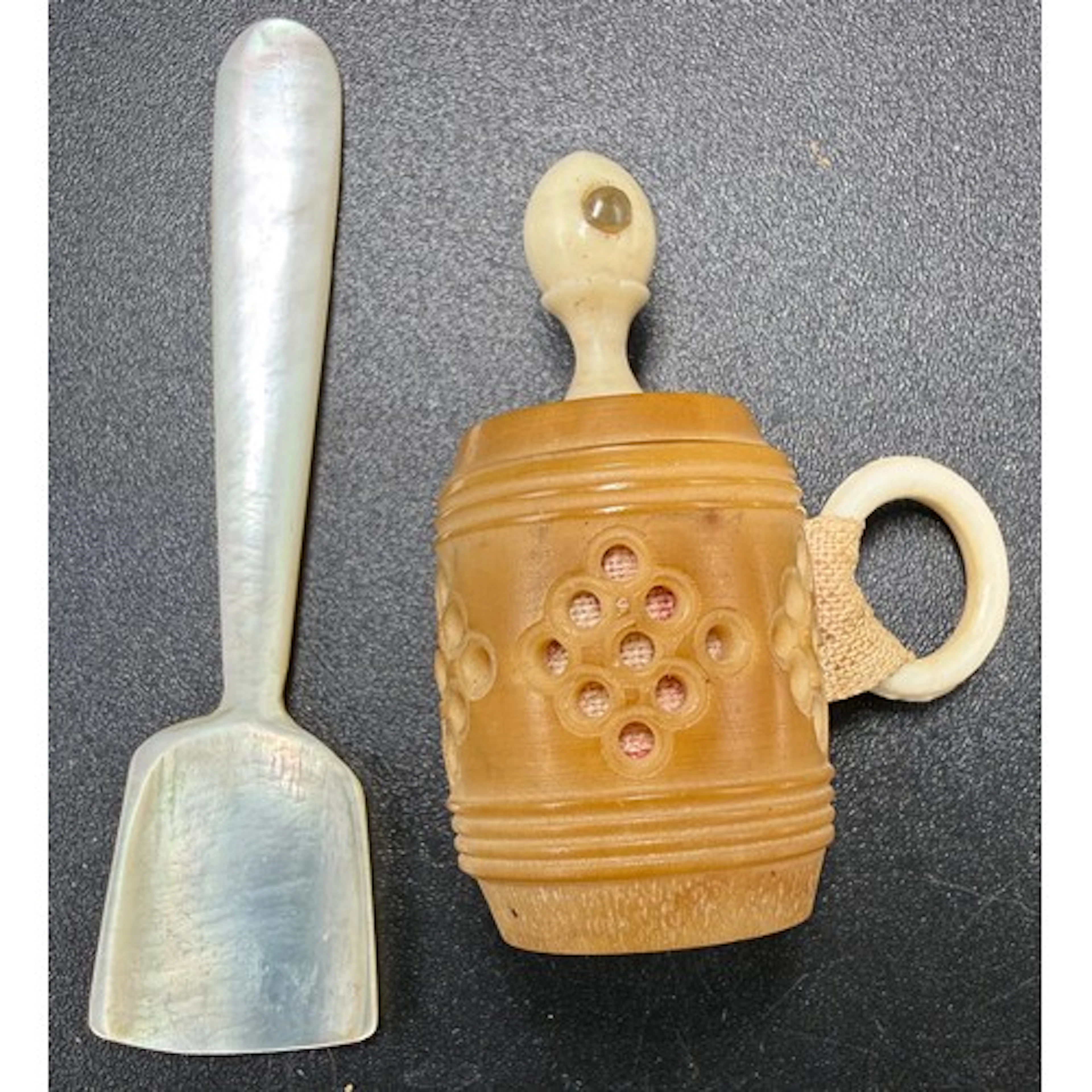 A Tagua nut and ivory barrel shaped Victorian tape measure f...