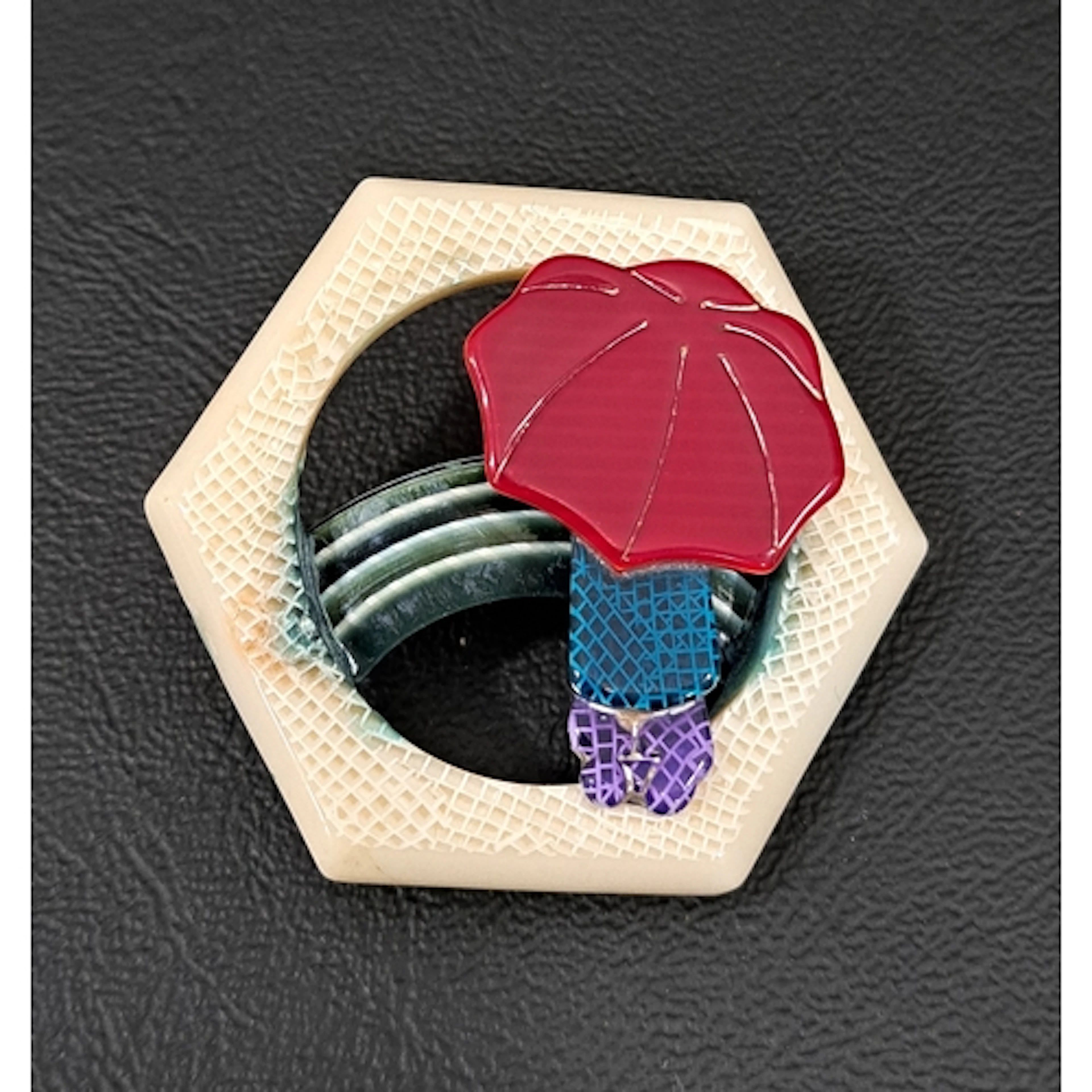 LEA STEIN UMBRELLA GIRL AND RAINBOW BROOCH the figure in tur...