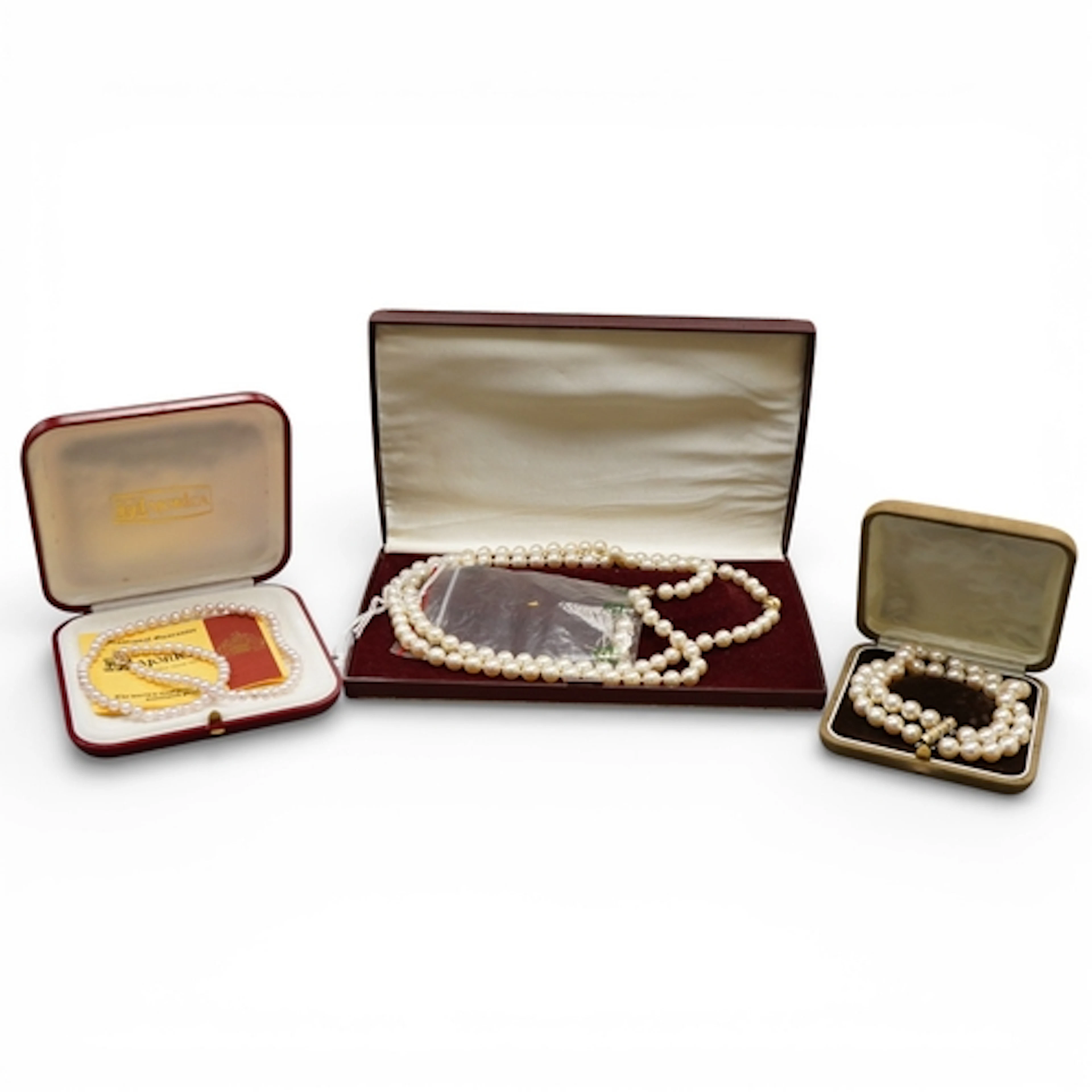 Two cultured pearl necklaces with 18ct and diamond set clasp...