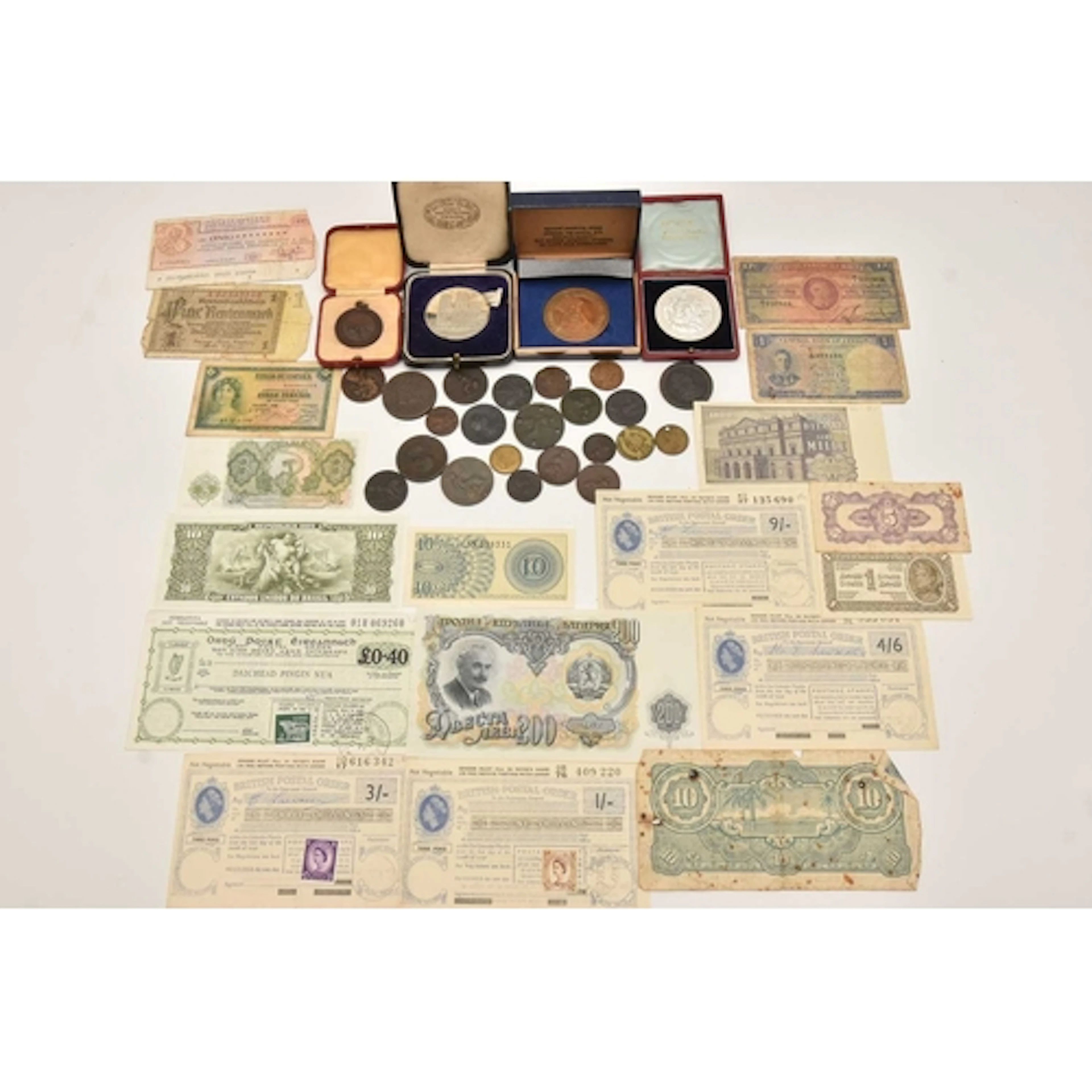 A mixed lot of coins, banknotes and medallions. A bag of ear...