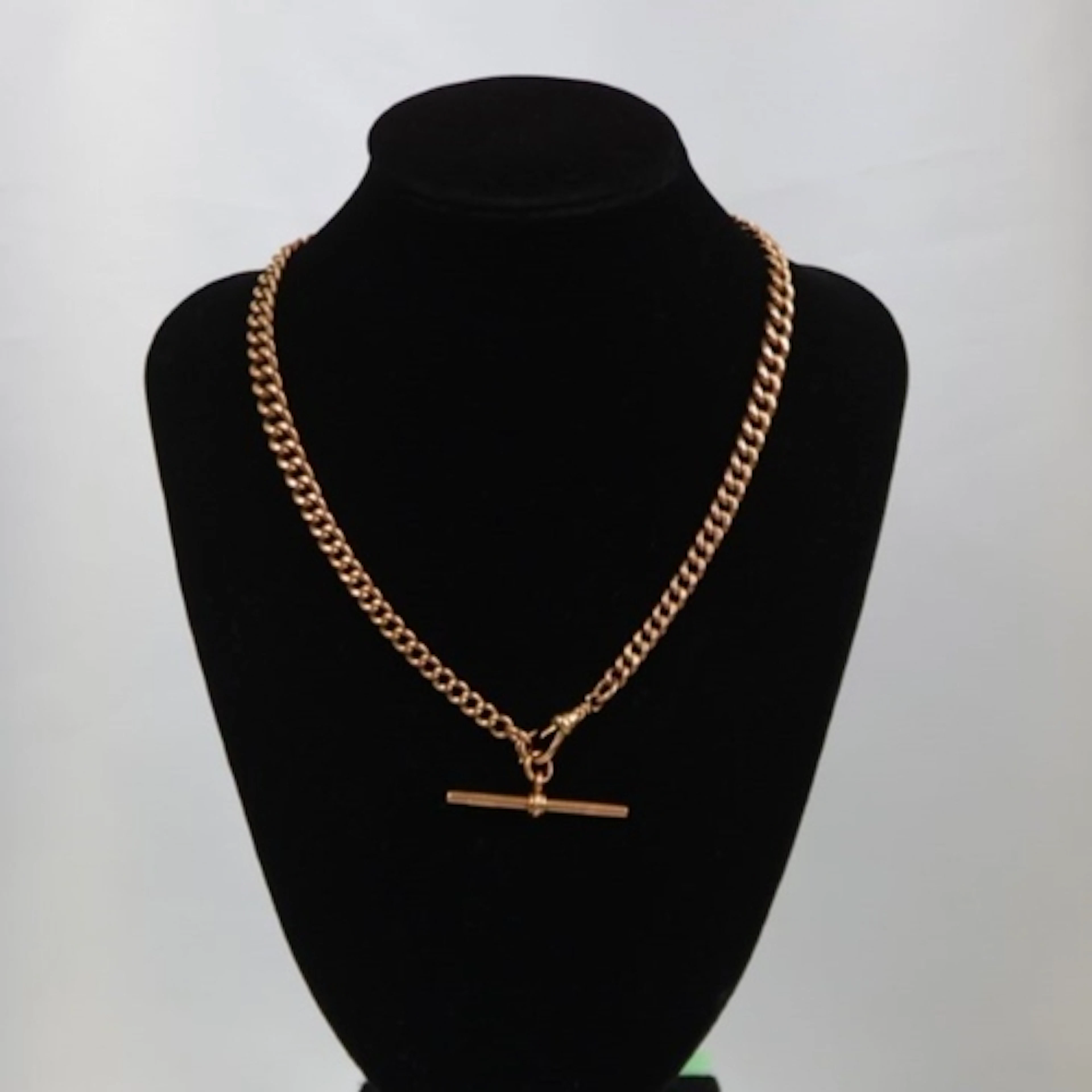 A 20th century 9ct gold watch chain, the graduated curb link...