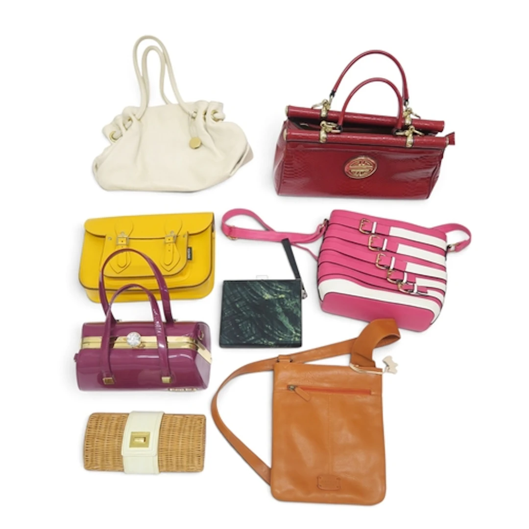 A collection of handbags including a white leather Furla bag...