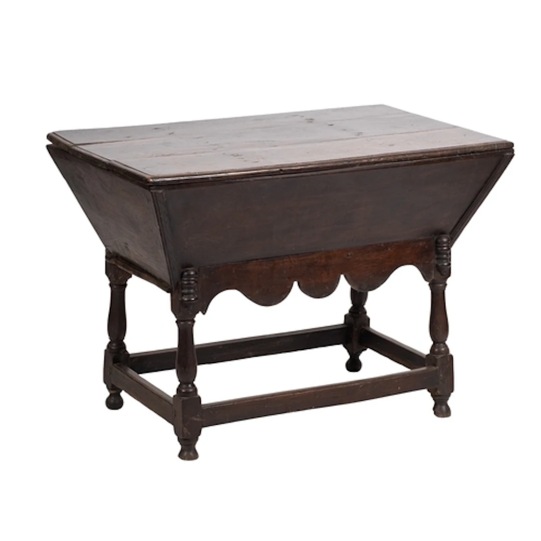 An oak dough bin, first half 18th century; the hinged rectan...