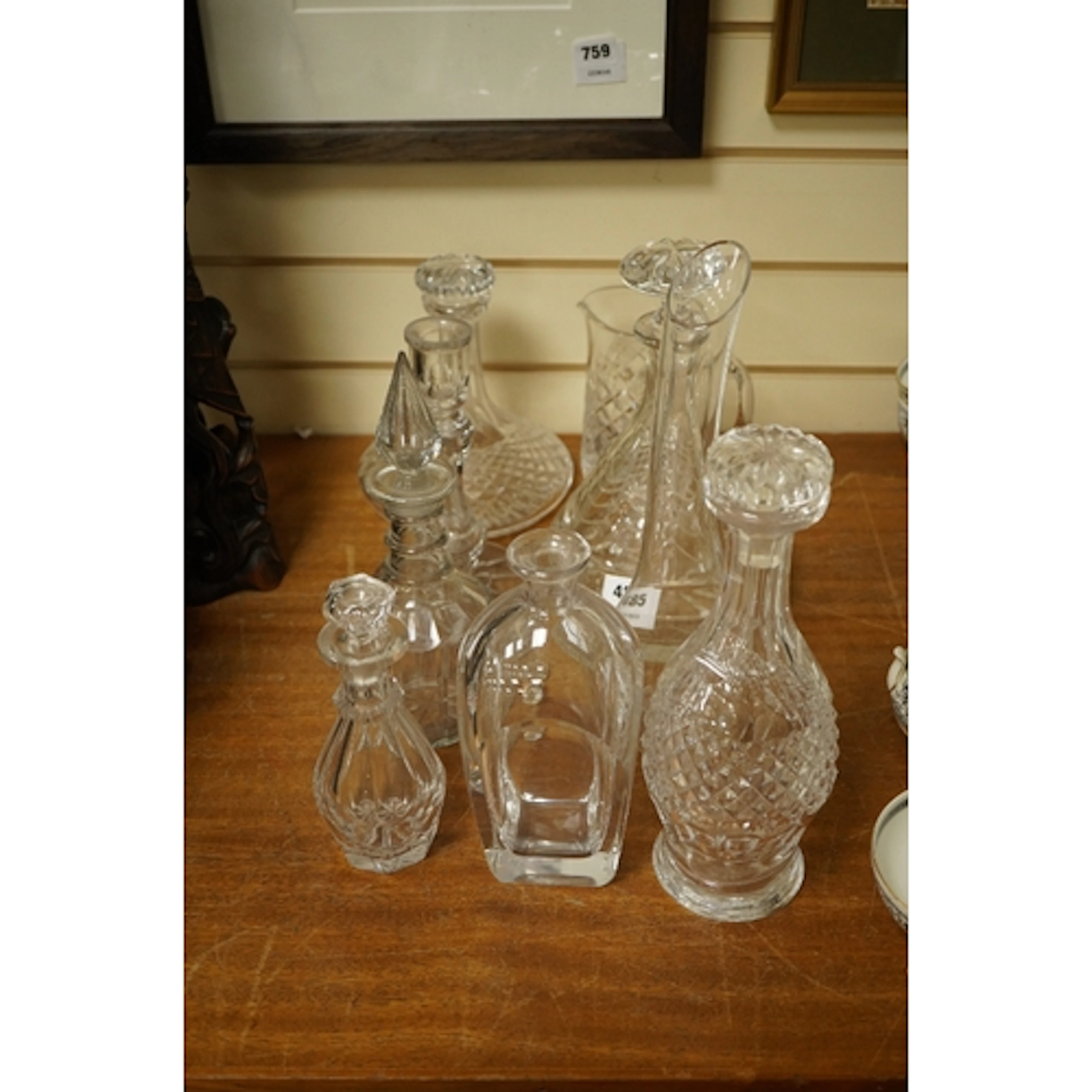 A quantity of cut and moulded glass to include a carafe, dec...