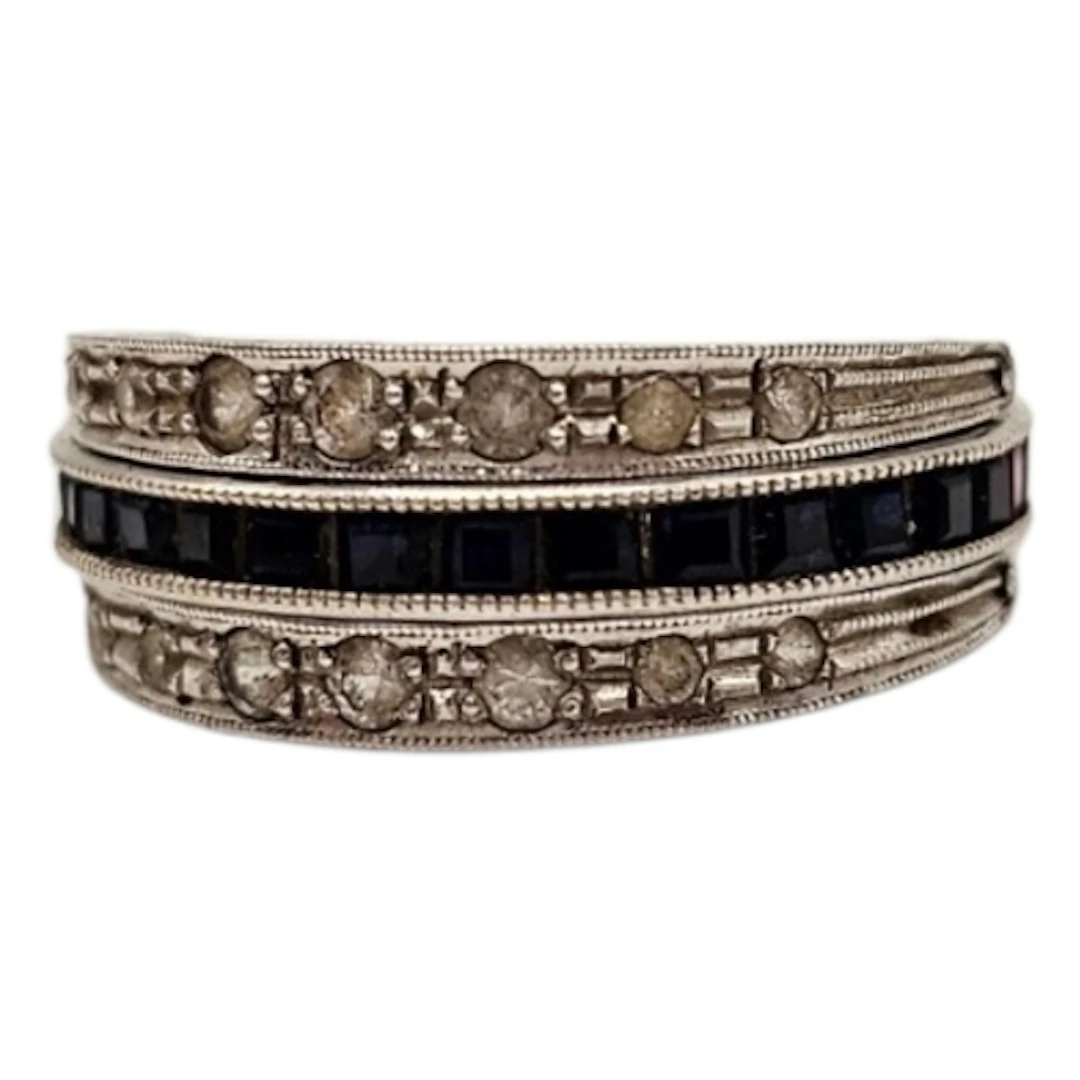 AN ART DECO 9CT GOLD AND GEM SET ETERNITY RING Two bands of ...