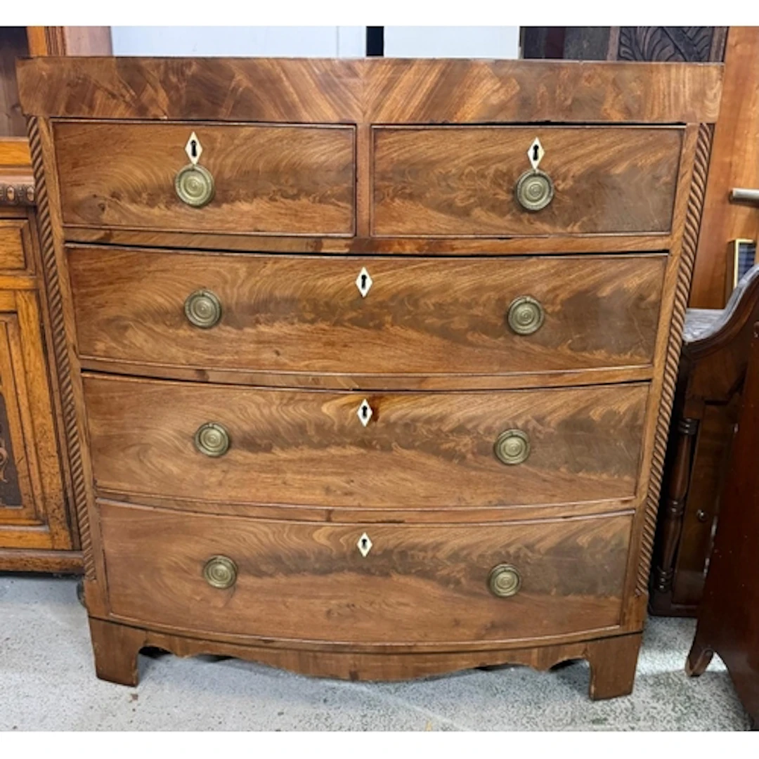 A Georgian mahogany two over three bow fronted chest of draw...