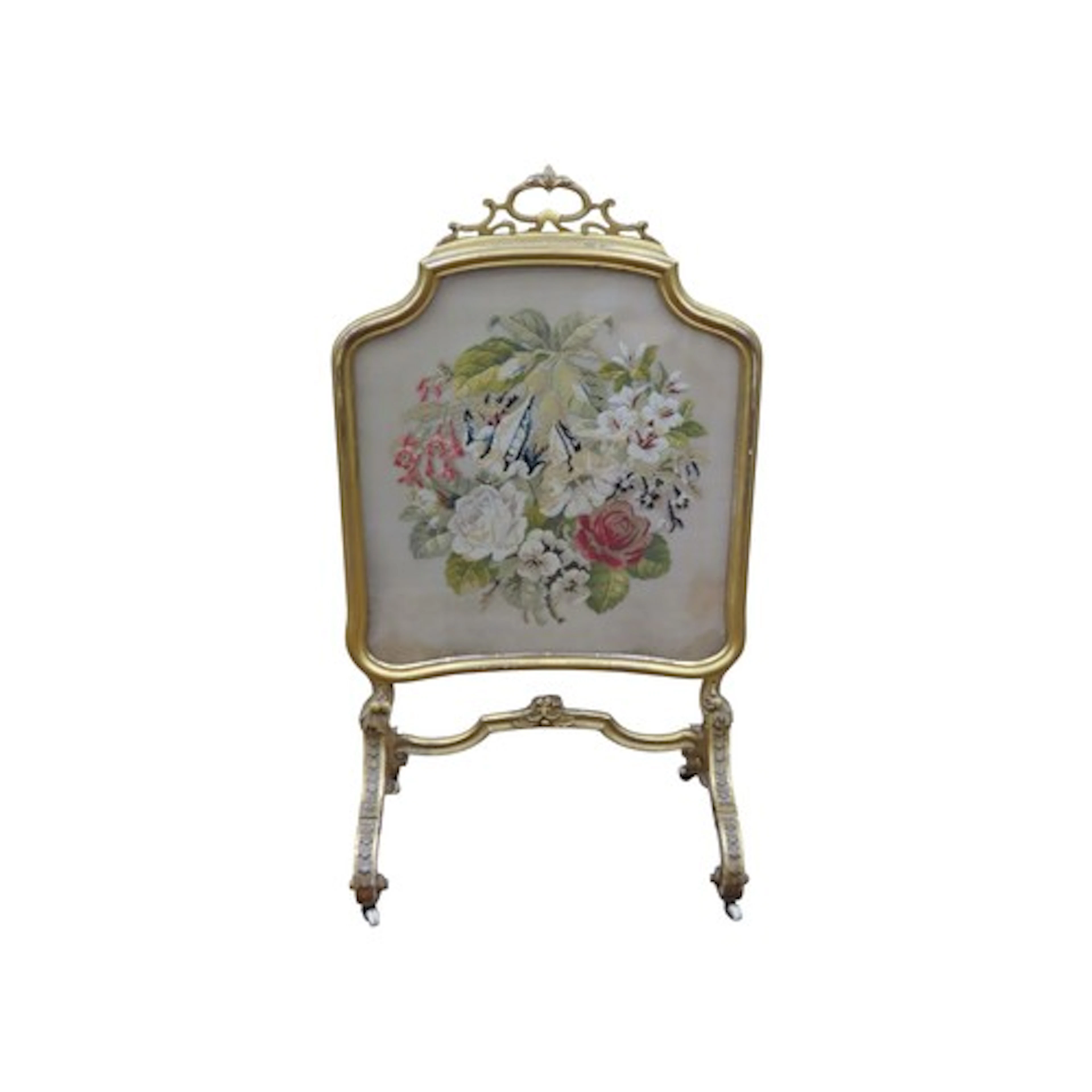 A mid-Victorian period freestanding fire screen with a shape...