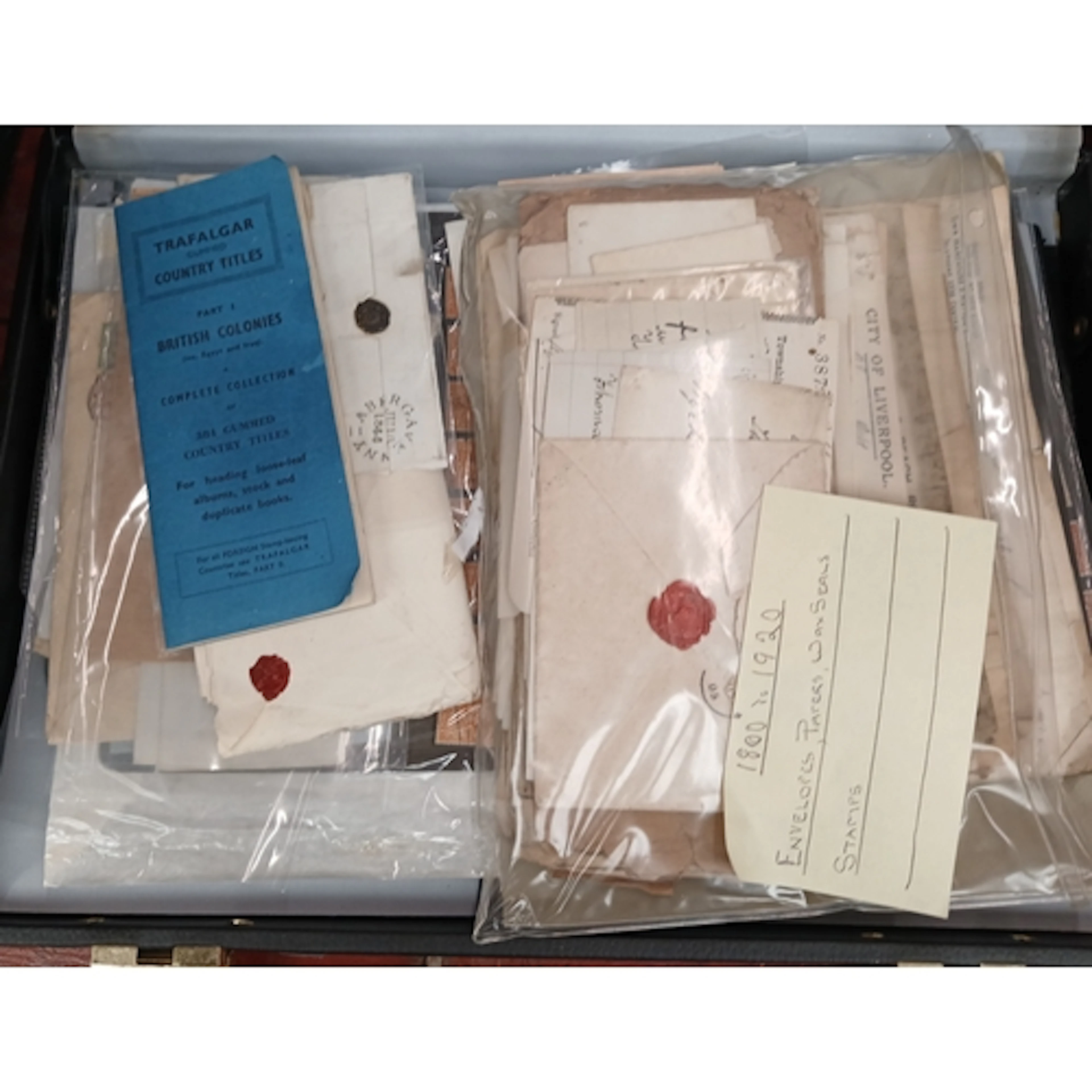 A case of assorted antique ephemera to include letters, enve...