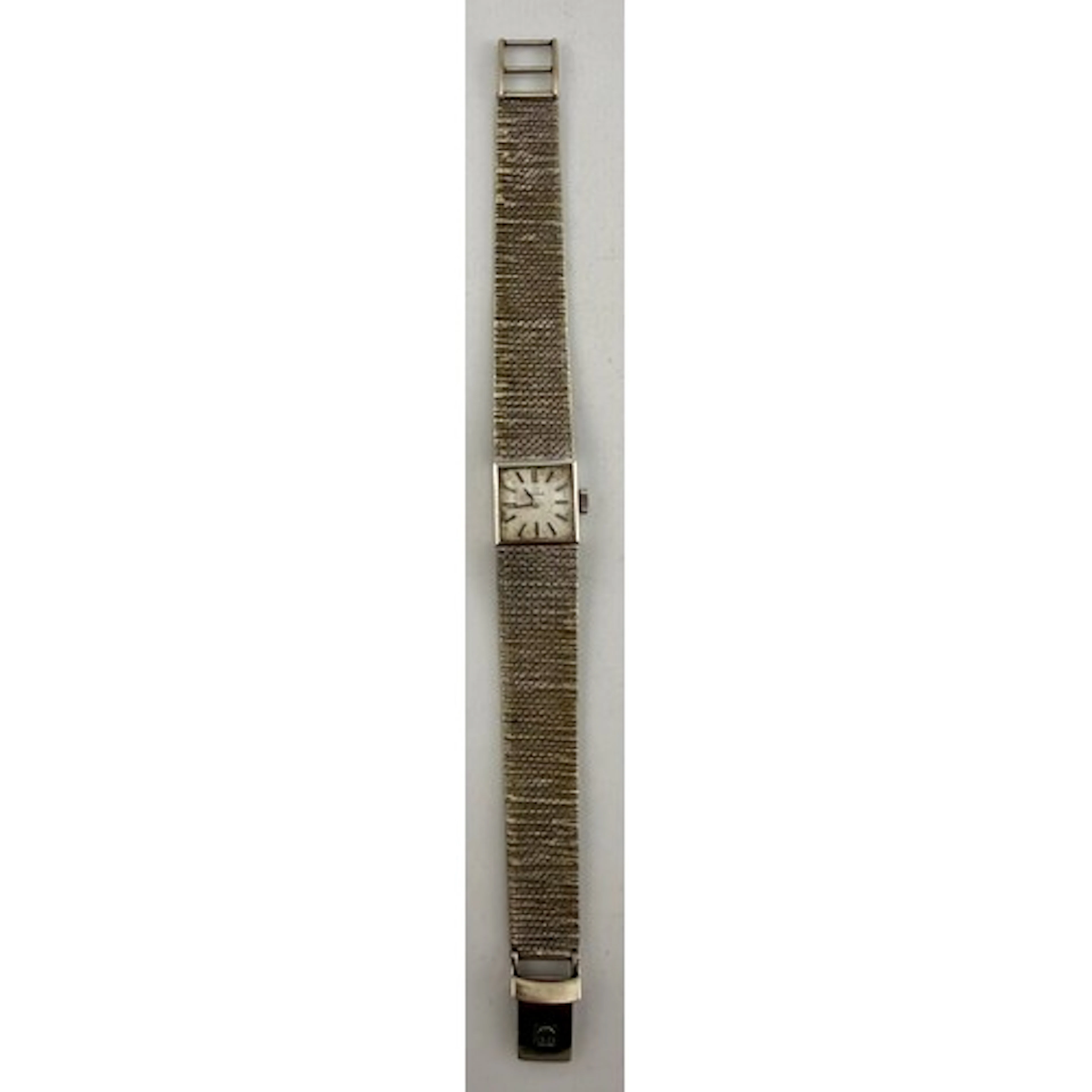 An Omega 9ct white gold lady's wristwatch, square watch face...