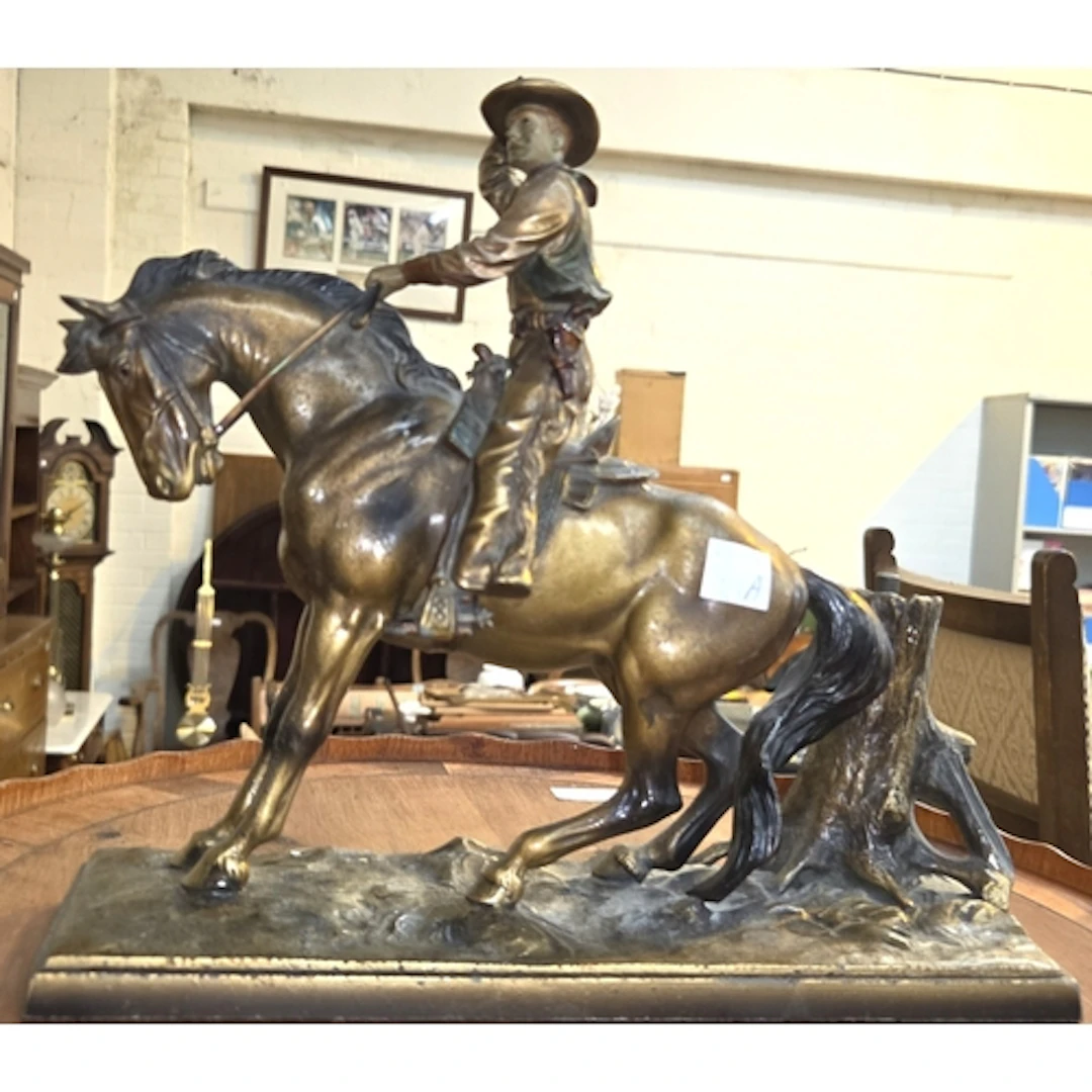 A novelty Western bronzed spelter match striker in the form ...