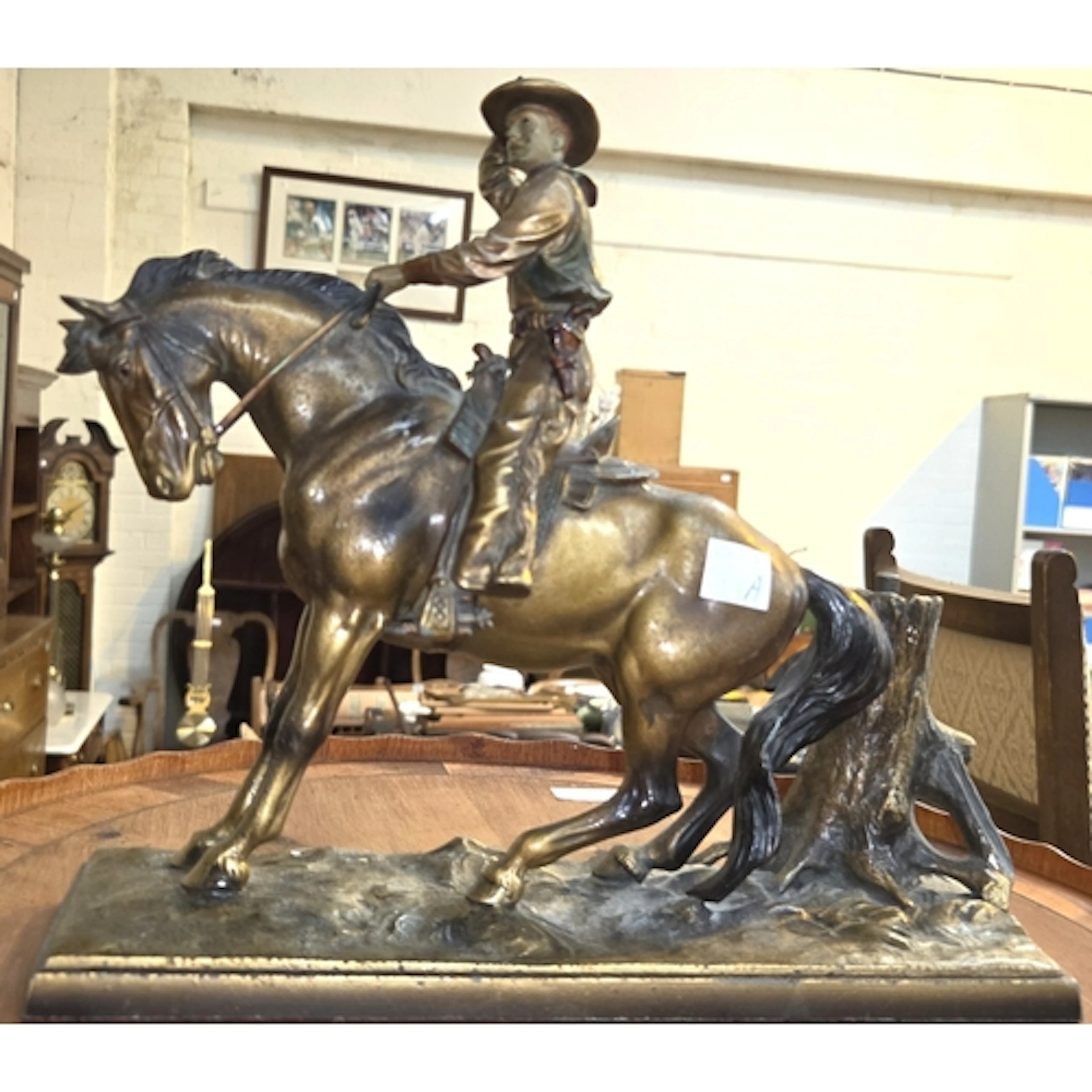 A novelty Western bronzed spelter match striker in the form ...